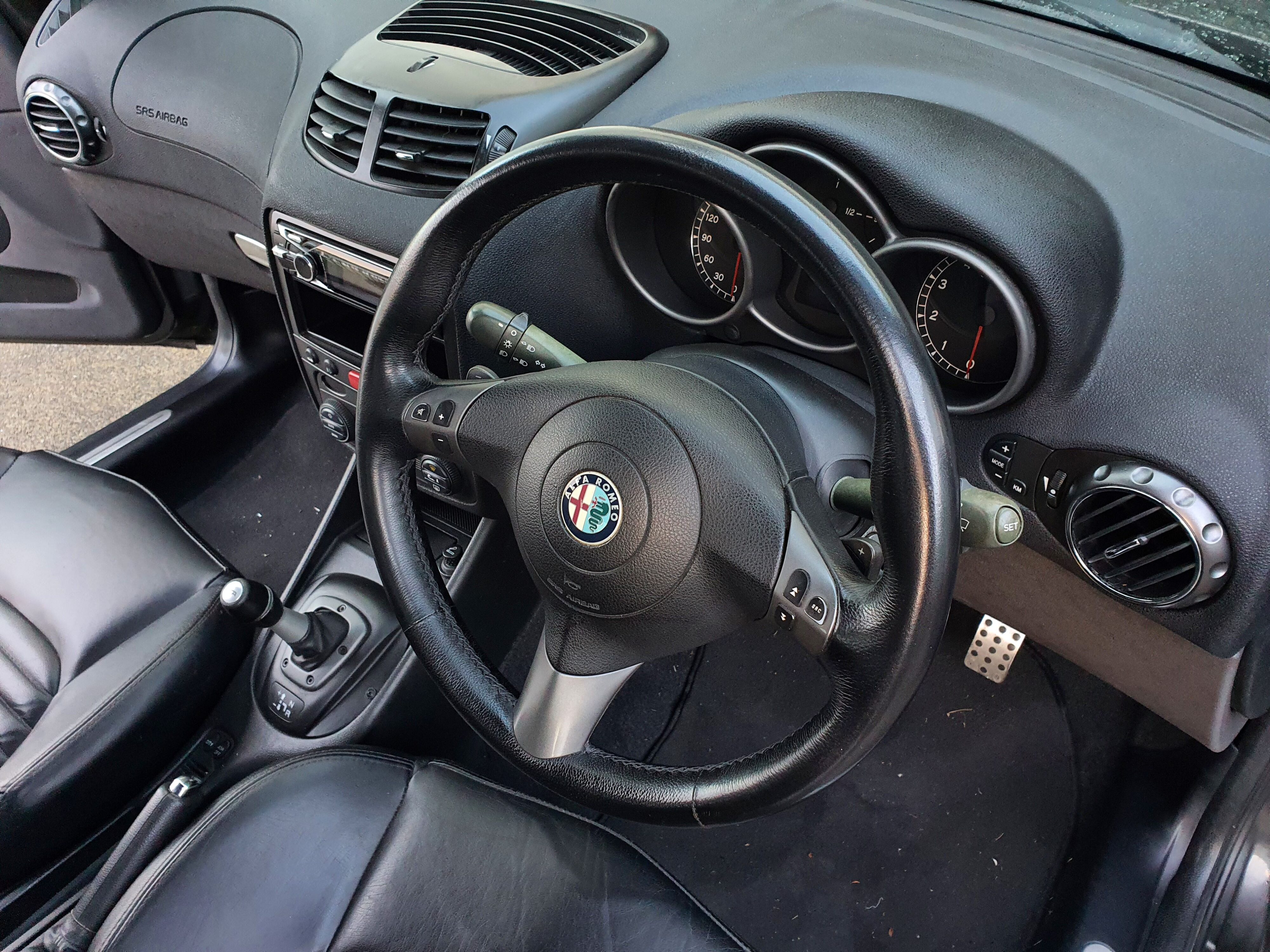 Photo of the interior of a 2004 Alfa Romeo 147 GTA after using Armor All's new Leather Protectant.