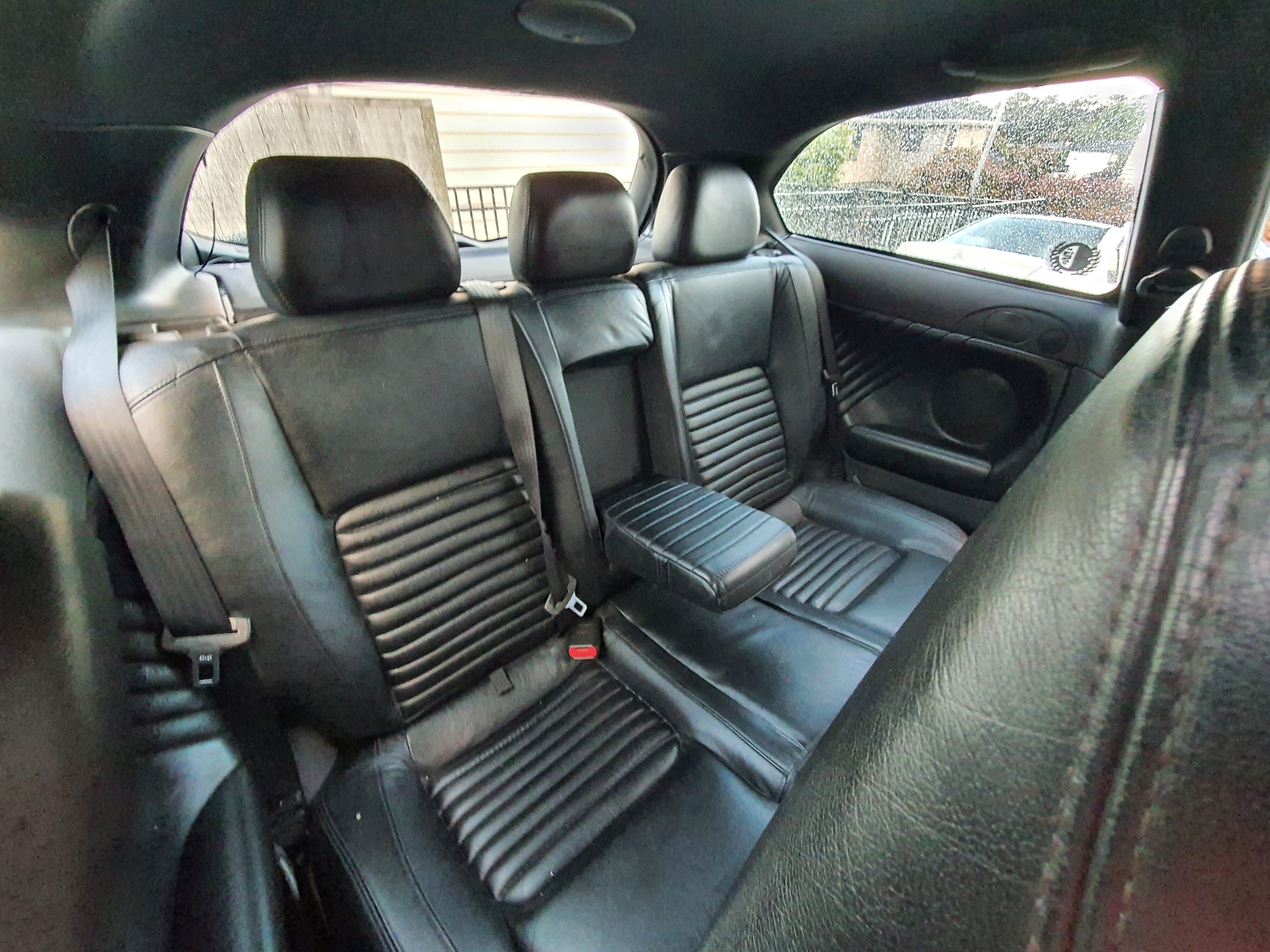 Photo of the leather rear seats on the interior of a 2004 Alfa Romeo 147 GTA after using Armor All's new Leather Protectant.