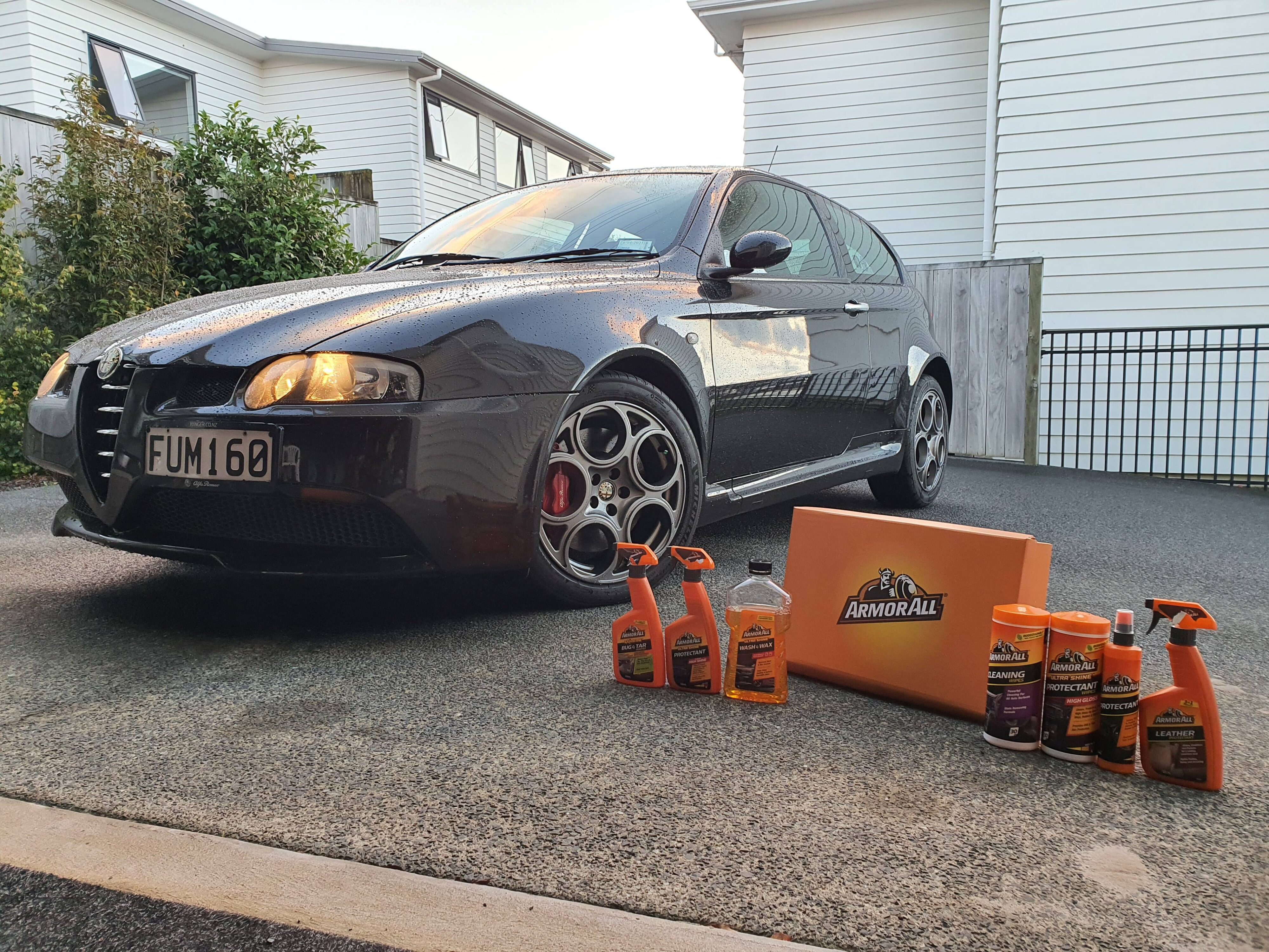 ArmorAll's brand new range of products including a Wash & Wax, Bug & Tar Remover, Interior Restorers, Interior Cleaning Wipes and a Leather Restorer, pictured with an Alfa Romeo 147 GTA.