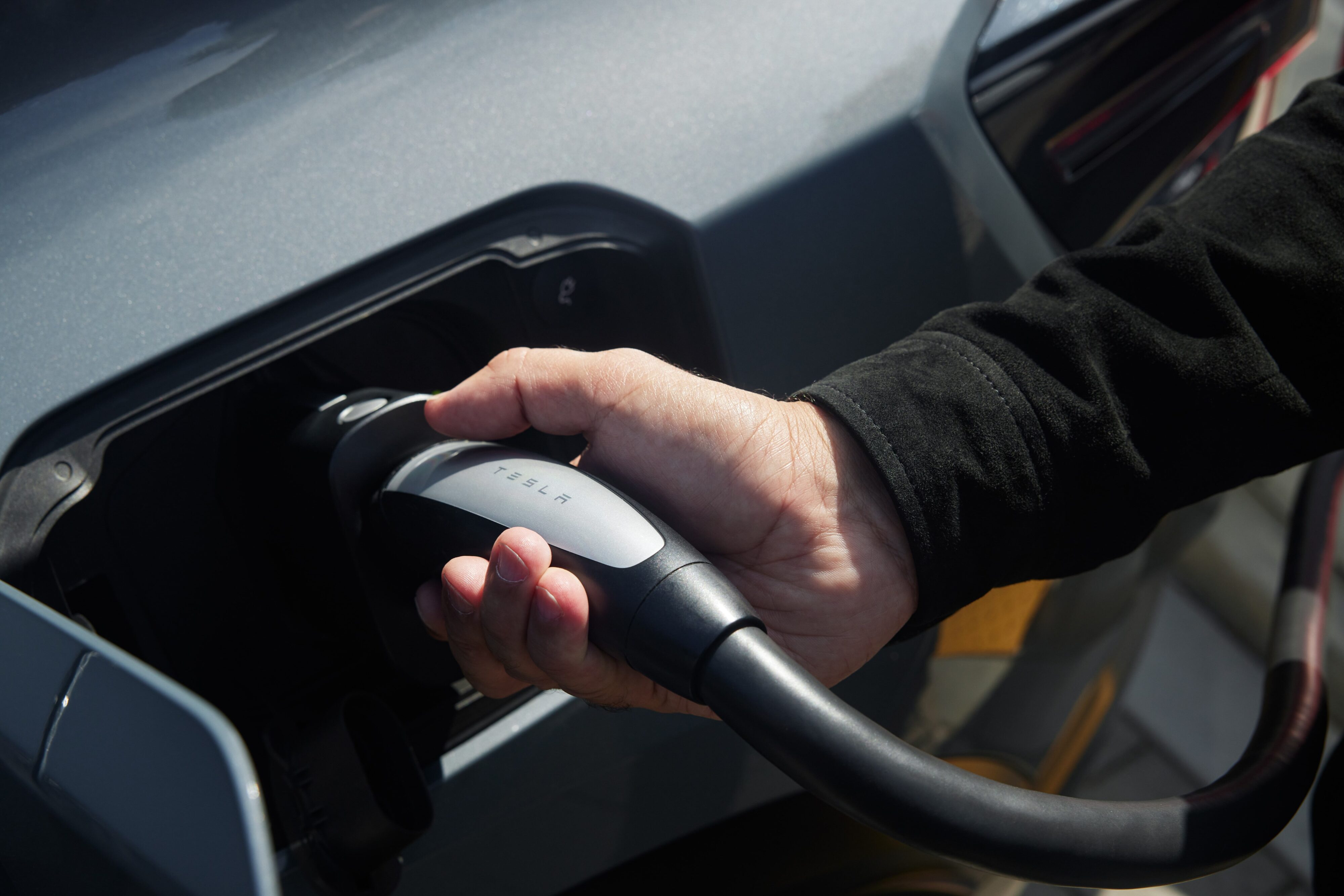 A Polestar owner using an NACS adapter on one of their EVs.