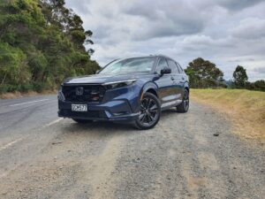 Front three quarters view of a 2024 Honda CR-V RS e:HEV in Canyon River Blue Metallic.