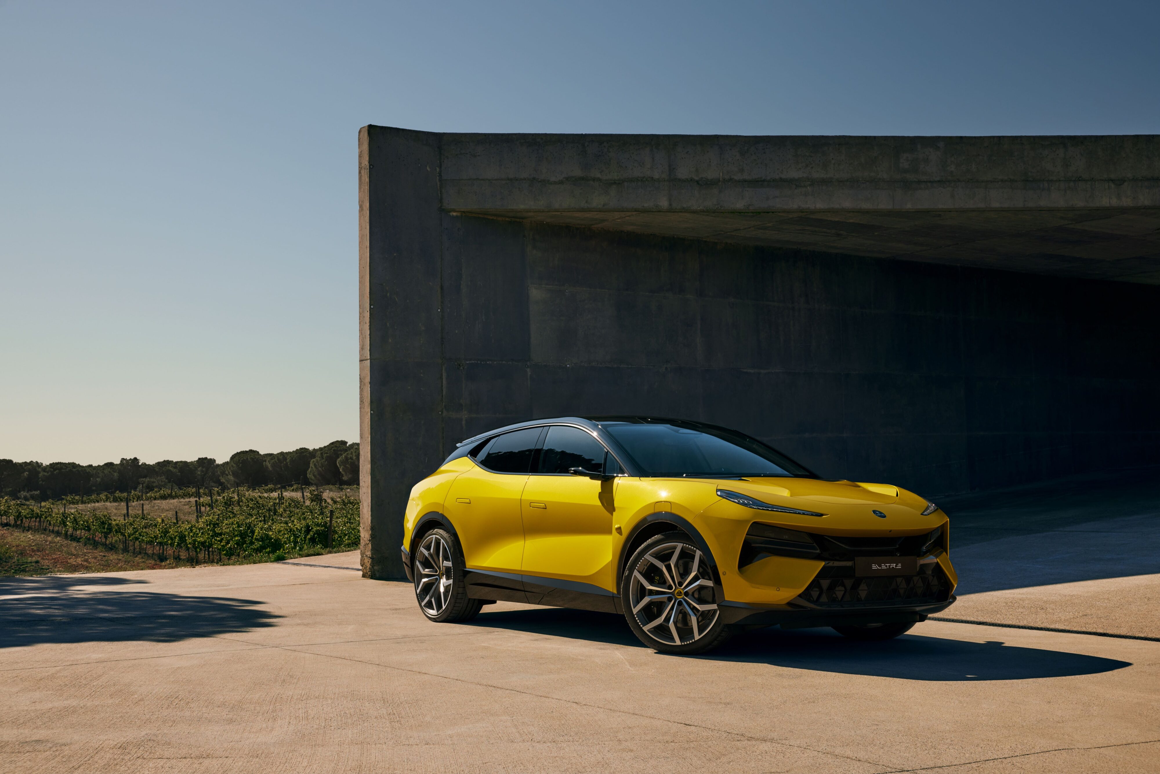 Front three quarters view of a Lotus Eletre in Solar Yellow.