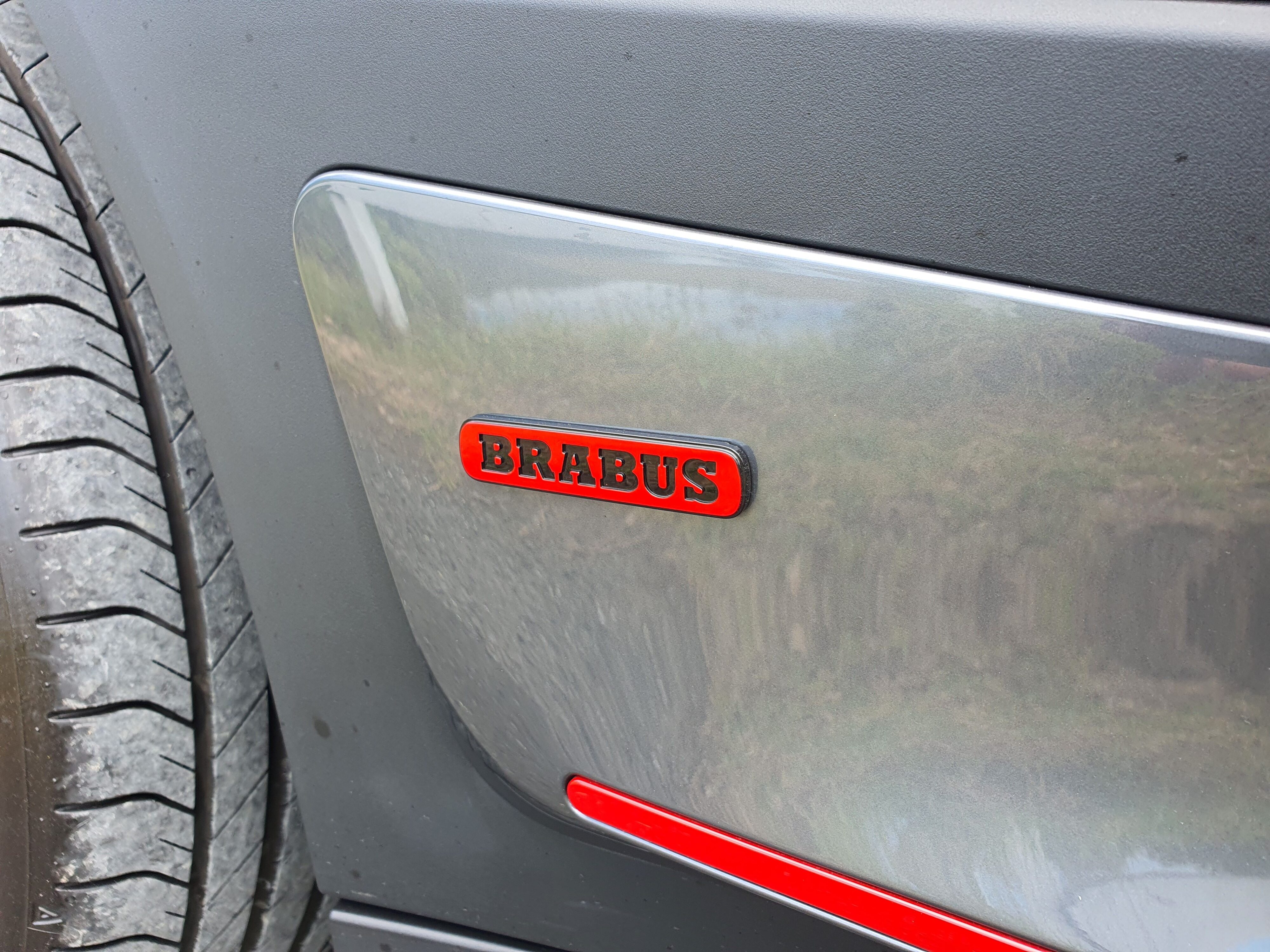 A Brabus badge on the side of a smart #1 Brabus.