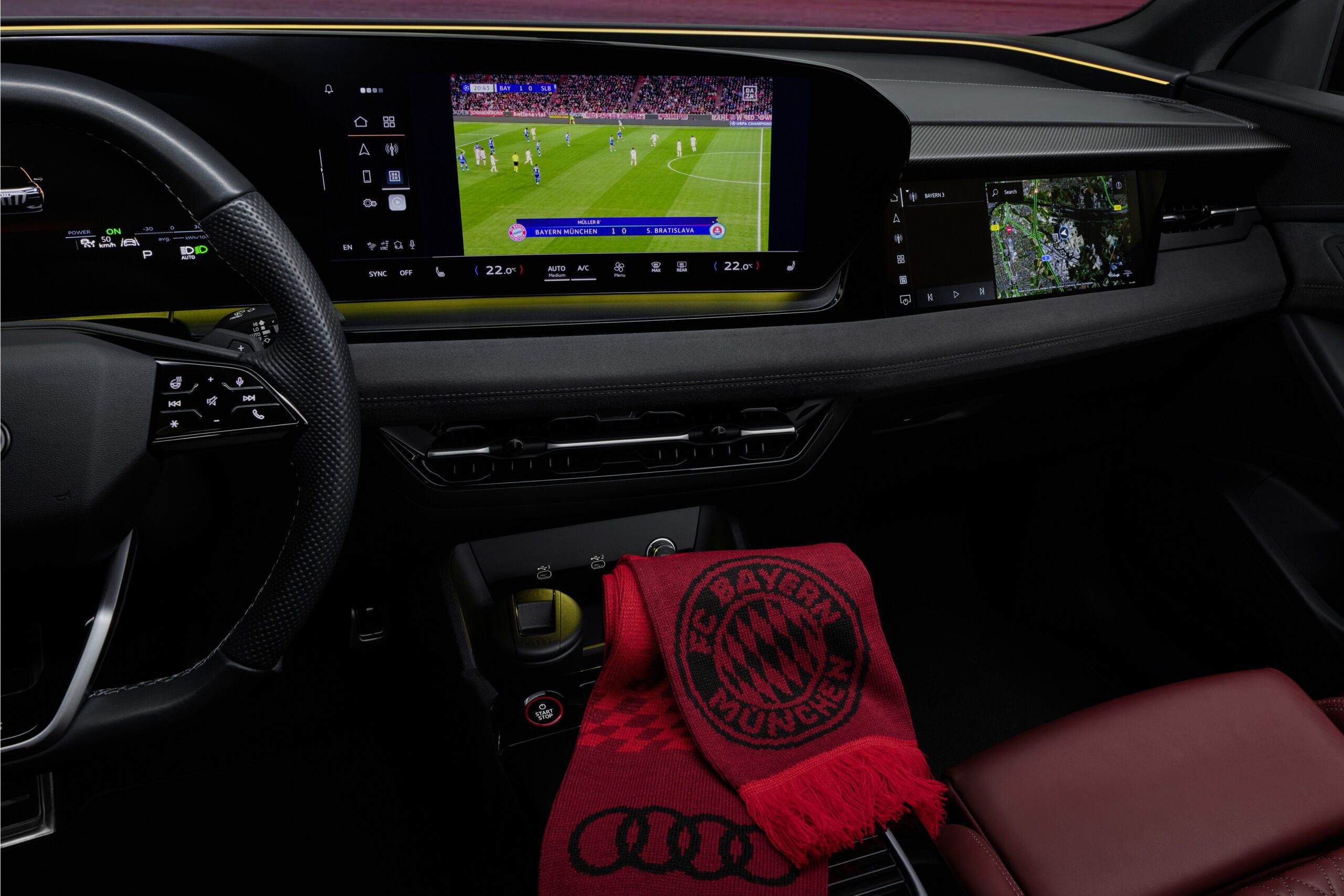 A football match being streamed on DAZN on the infotainment screen of an Audi.