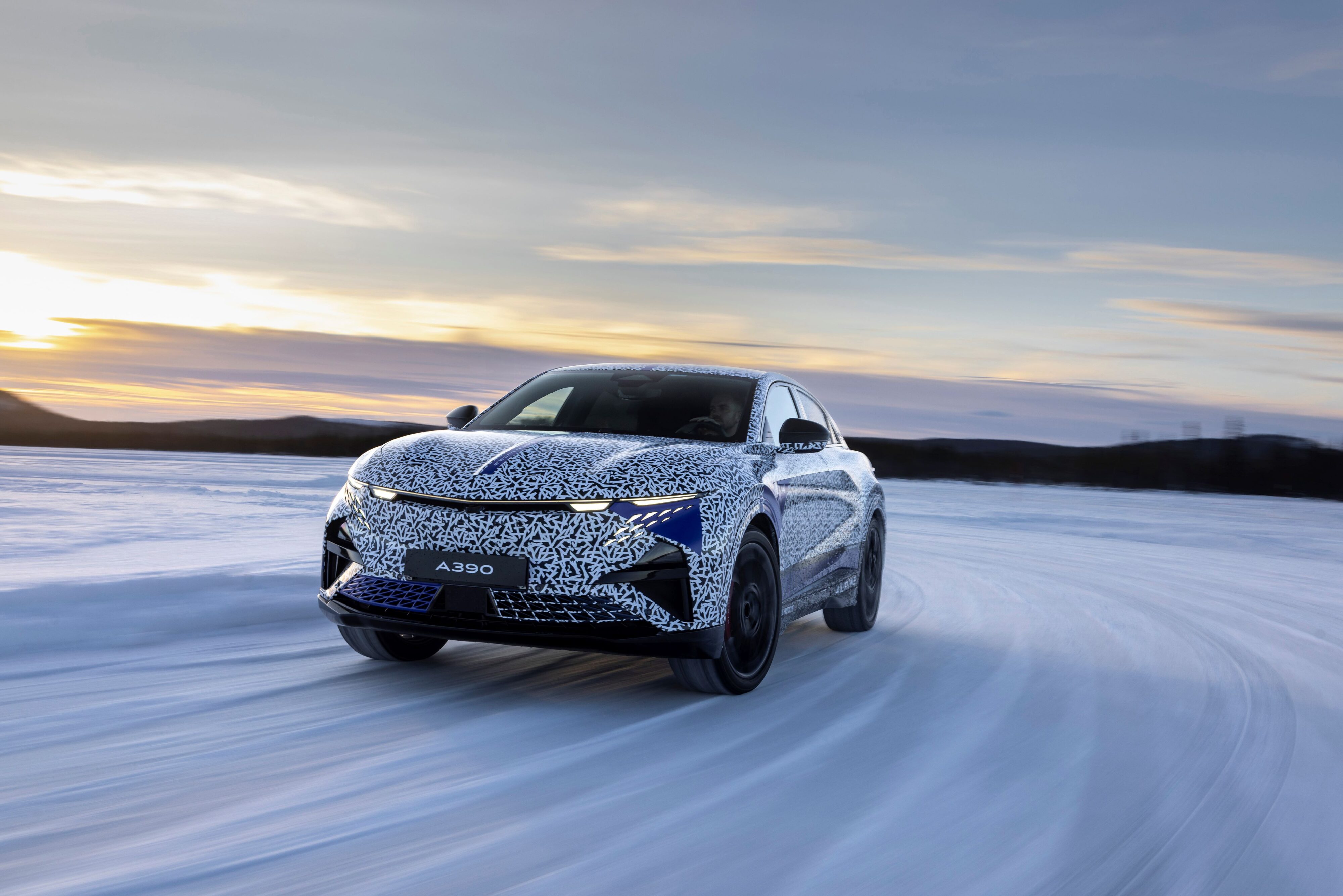Alpine A390 under camouflage, testing in the Arctic Circle. Front three quarters view of the car in motion.