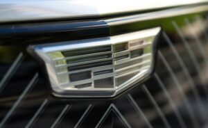 A photo of the Cadillac logo on the nose of a car.