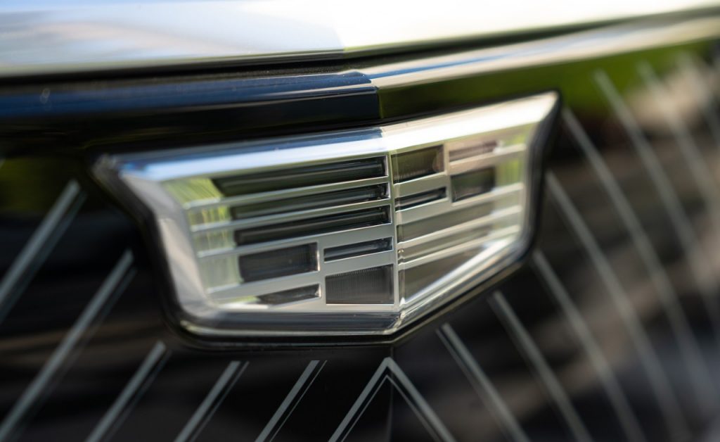 A photo of the Cadillac logo on the nose of a car.