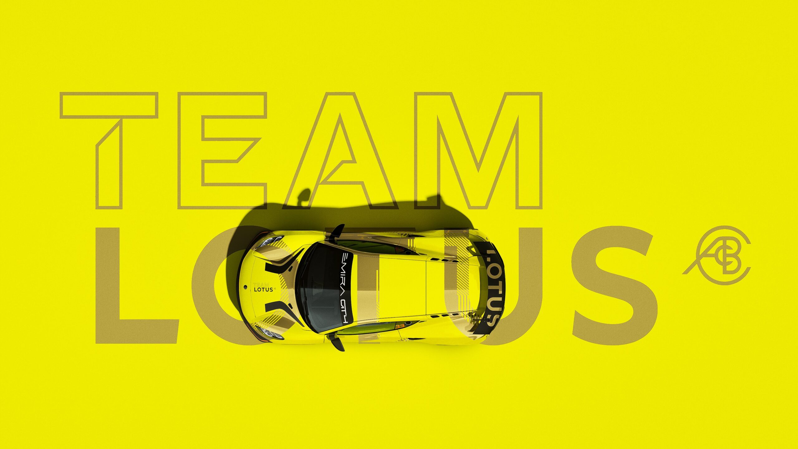 A promotional photo showing a yellow Lotus Emira GT4 with the words Team Lotus in the background.
