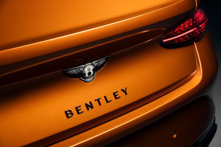 Rear view of a Bentley Continental GT Black Edition with black Bentley Wings.