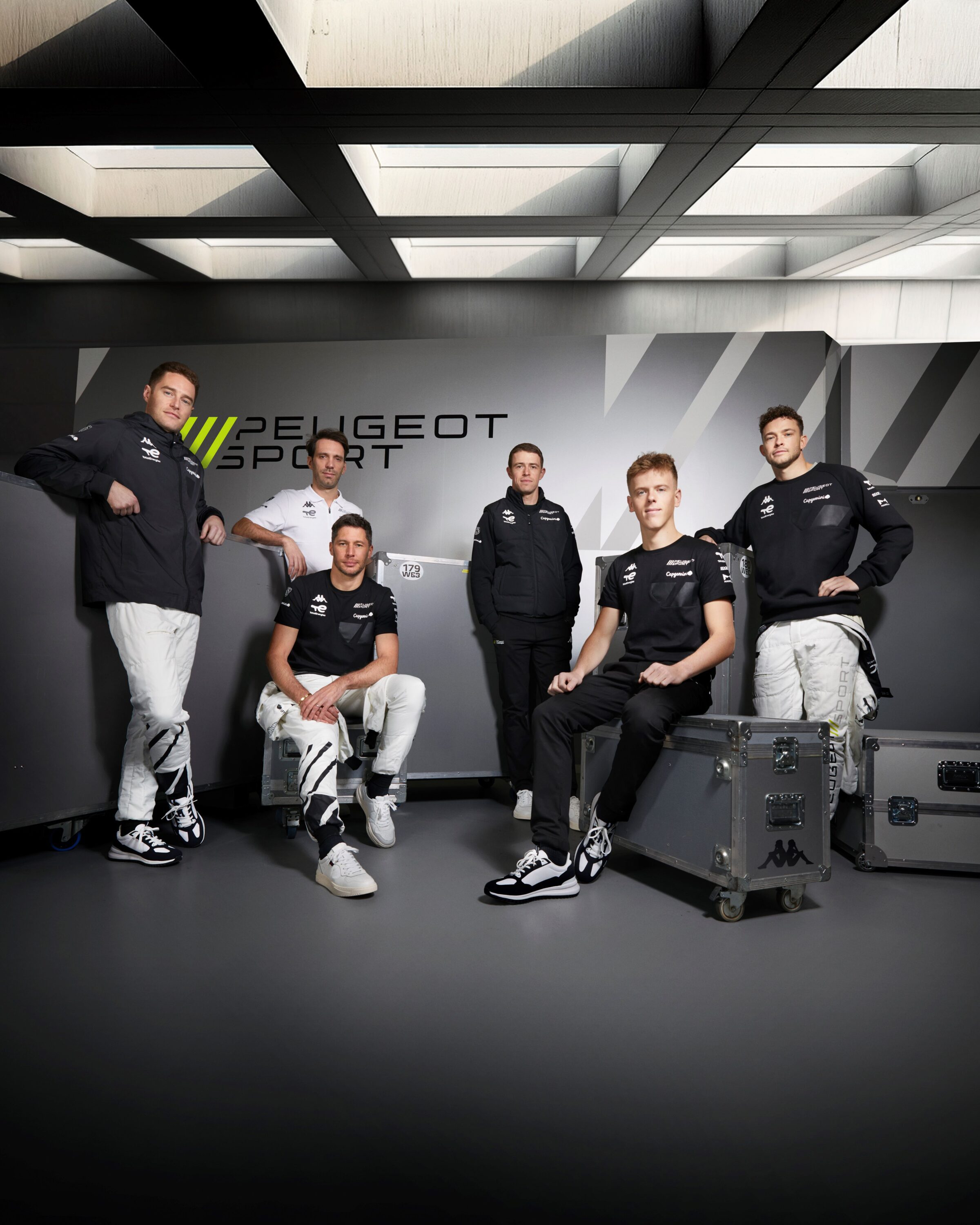 The Peugeot Sport TotalEnergies WEC team driver lineup poses in the new range of Kappa x Peugeot Sport clothing.