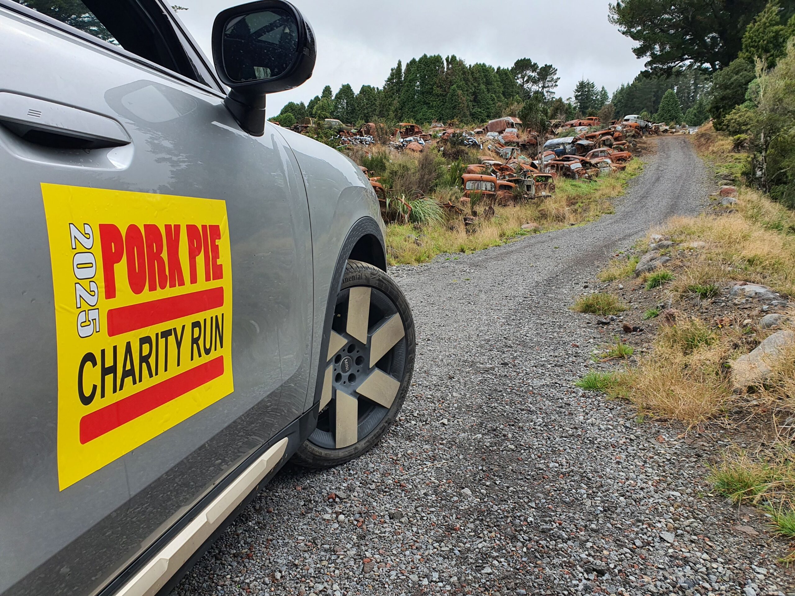 A sticker of the 2025 Pork Pie Charity Run on the right side of a 2025 Mini Countryman S.