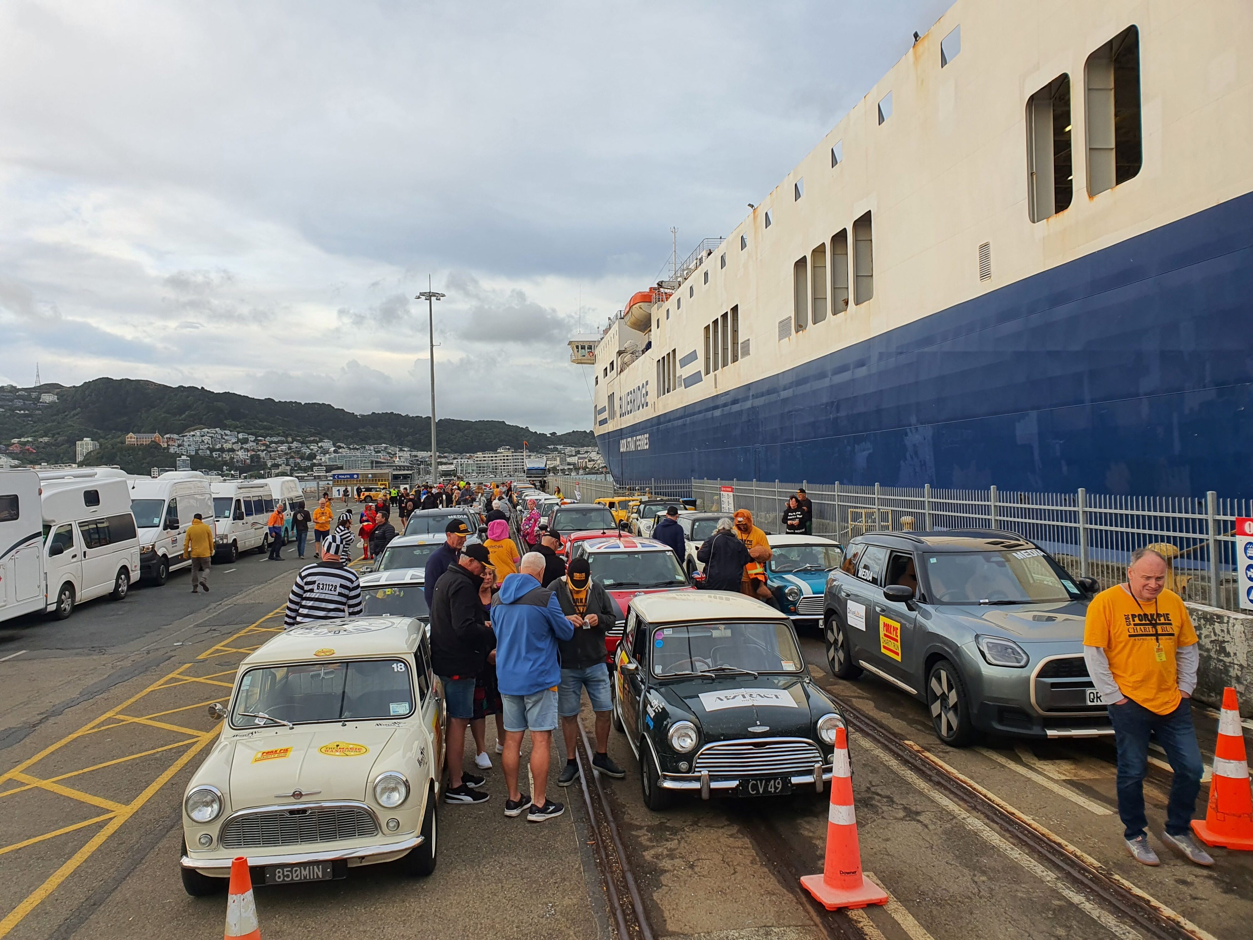 Minis gather outside the BlueBridge ferry at the start of day three of the 2025 Pork Pie Charity Run.