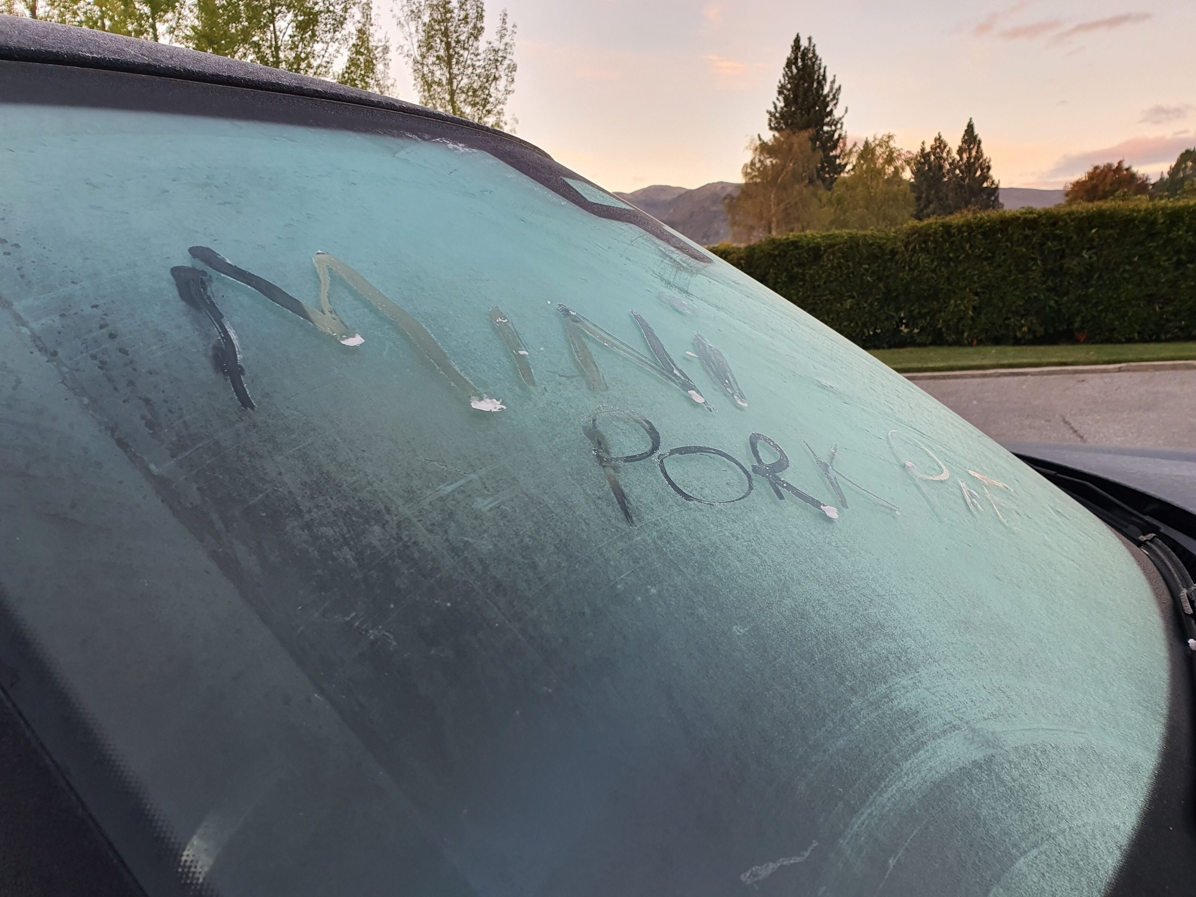 'Mini Pork Pie' is inscribed onto the frosted windscreen of a 2025 Mini Countryman SE in Cromwell, Otago.