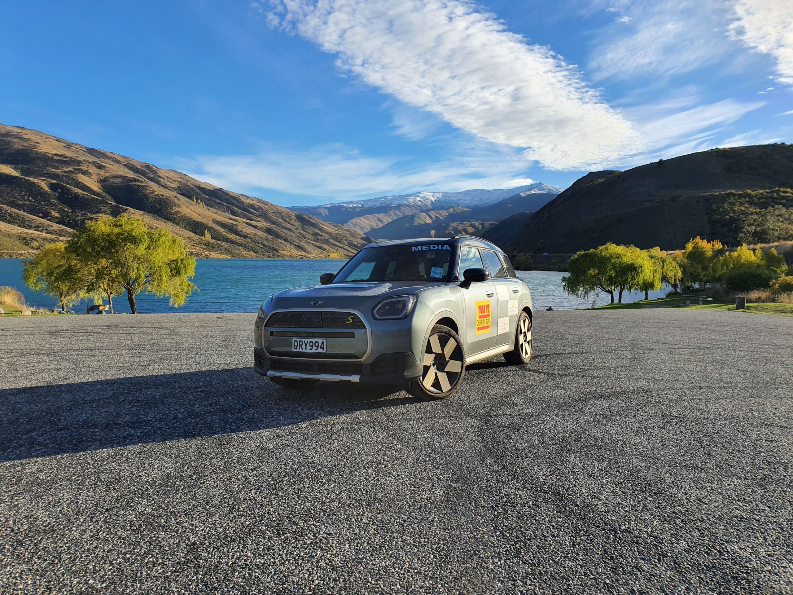 Front three quarters view of a 2025 Mini Countryman SE All4 with Employee Lab branding pictured in the Cromwell Gorge on the 2025 Pork Pie Charity Run.