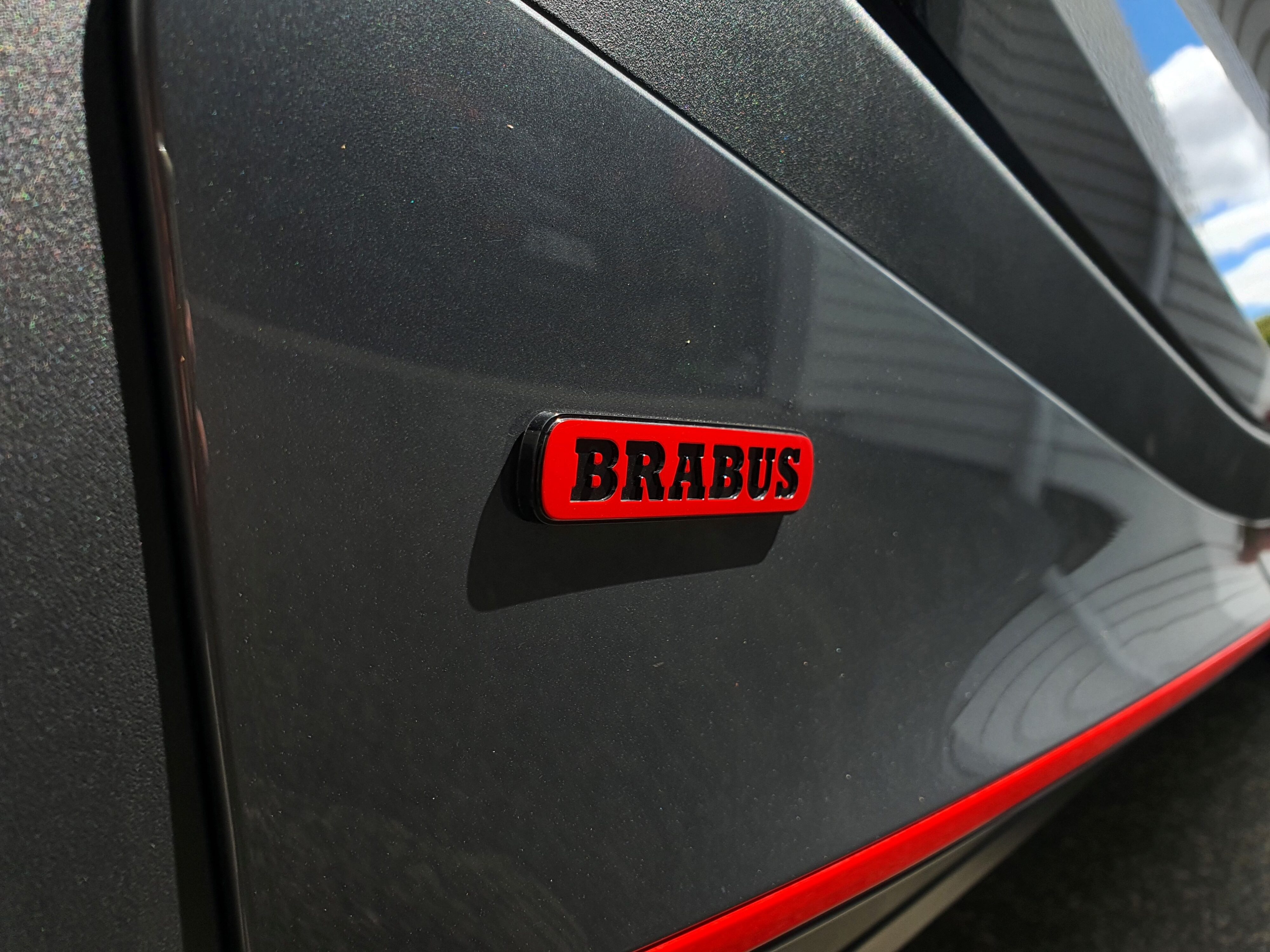 Red Brabus badging on the side sills of a smart #1 Brabus.
