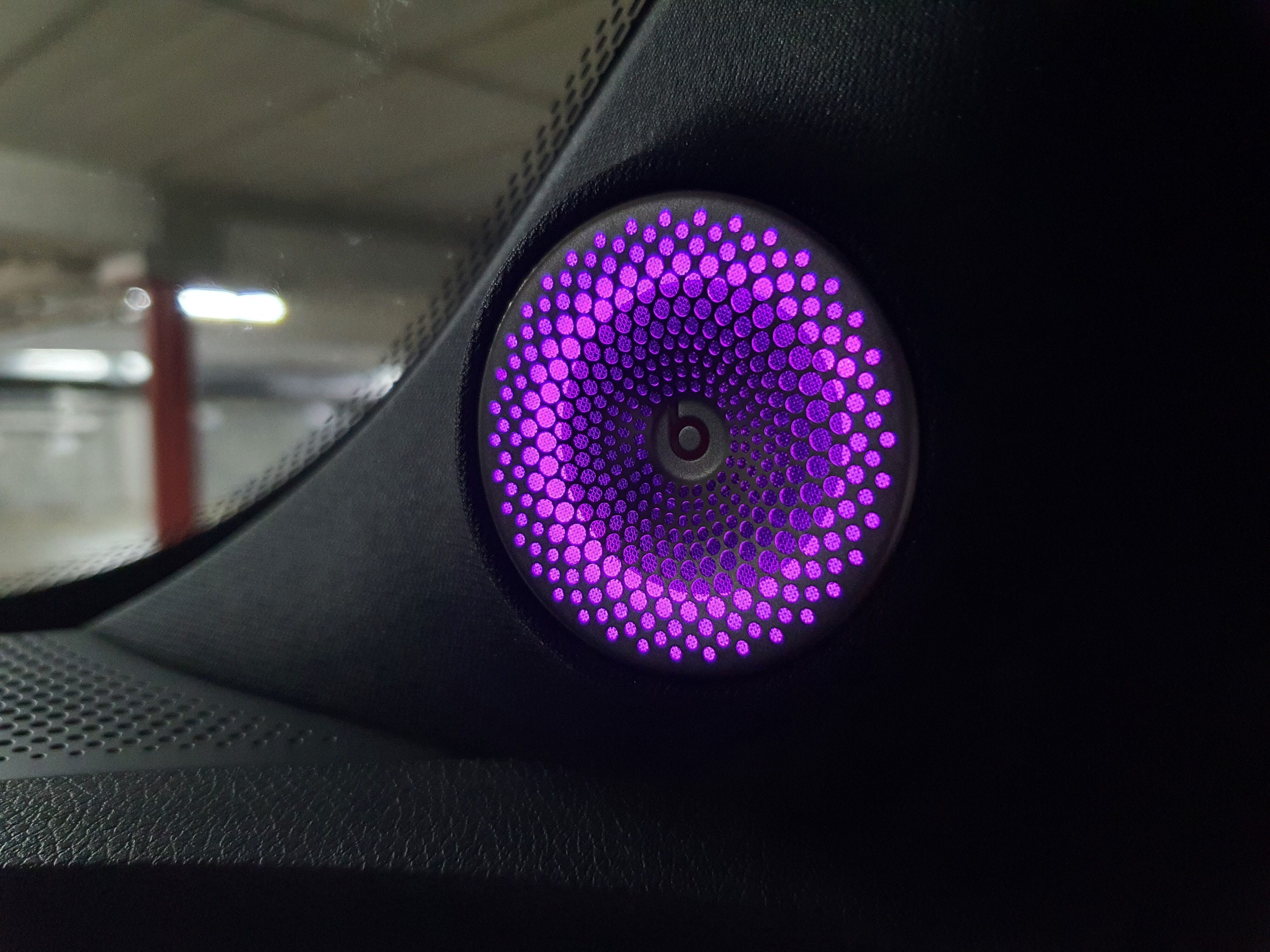 View of the LED backlit Beats Audio speakers on the inside of a smart #1 Brabus.