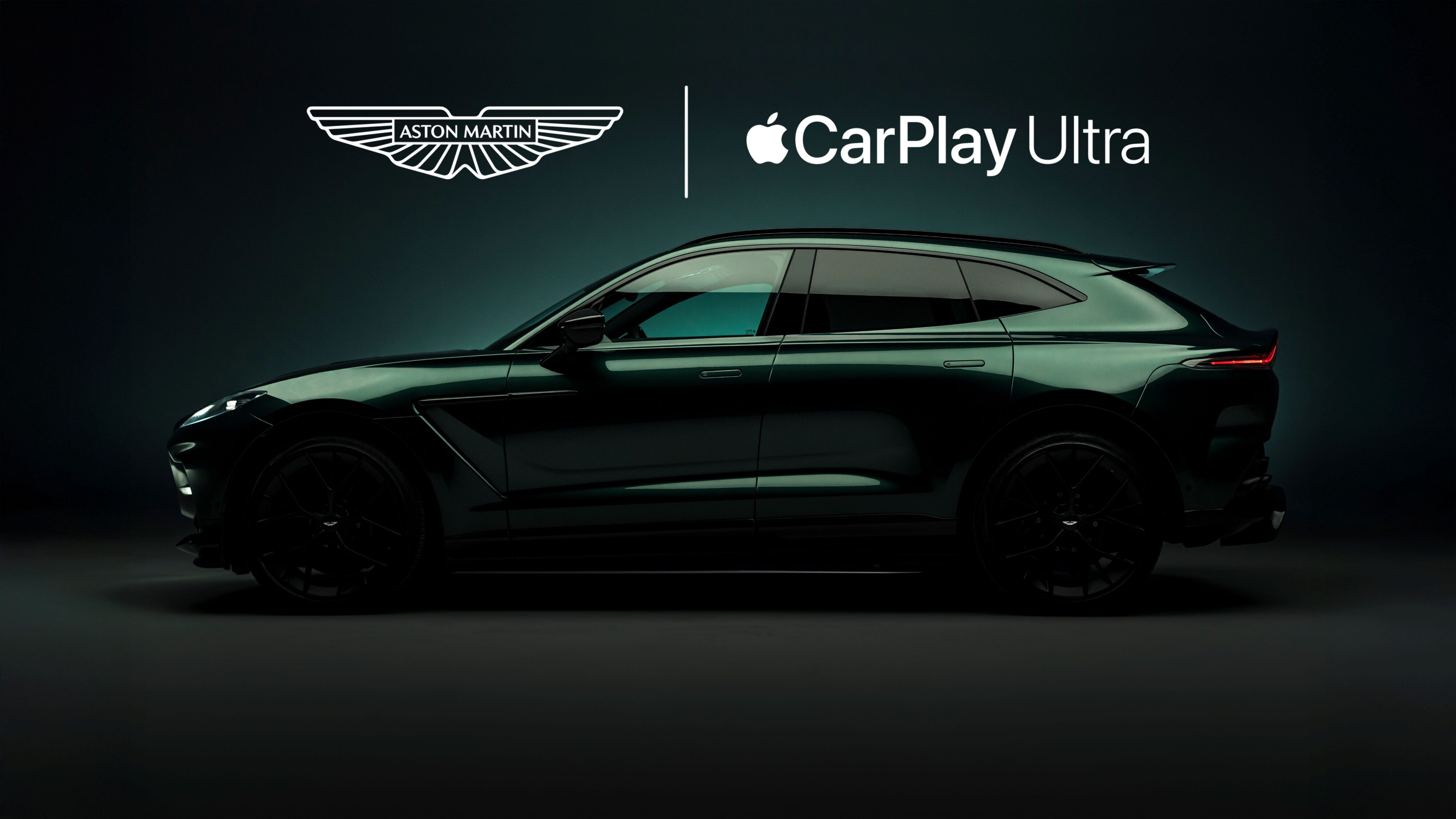 Side on view of a green Aston Martin DBX with promotional text saying Apple CarPlayUltra.