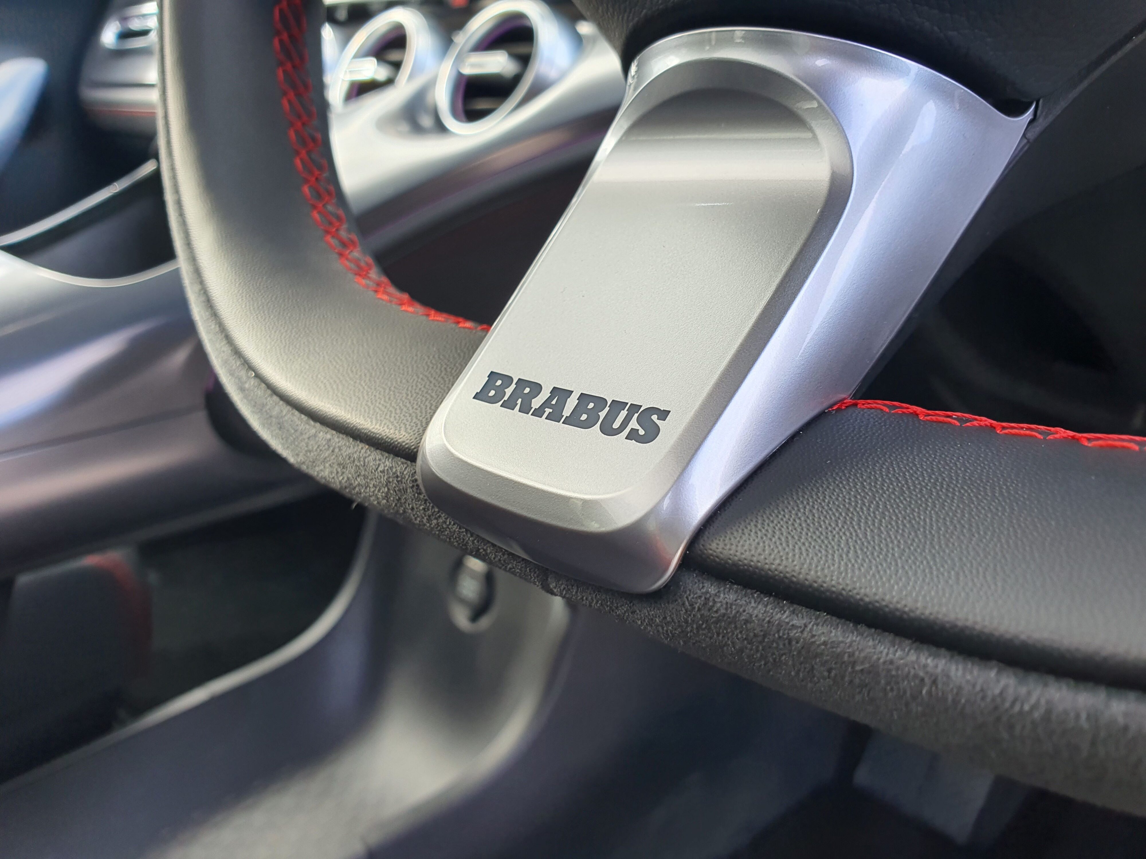 Brabus lettering on the bottom spoke of the steering wheel on a smart #3 Brabus.