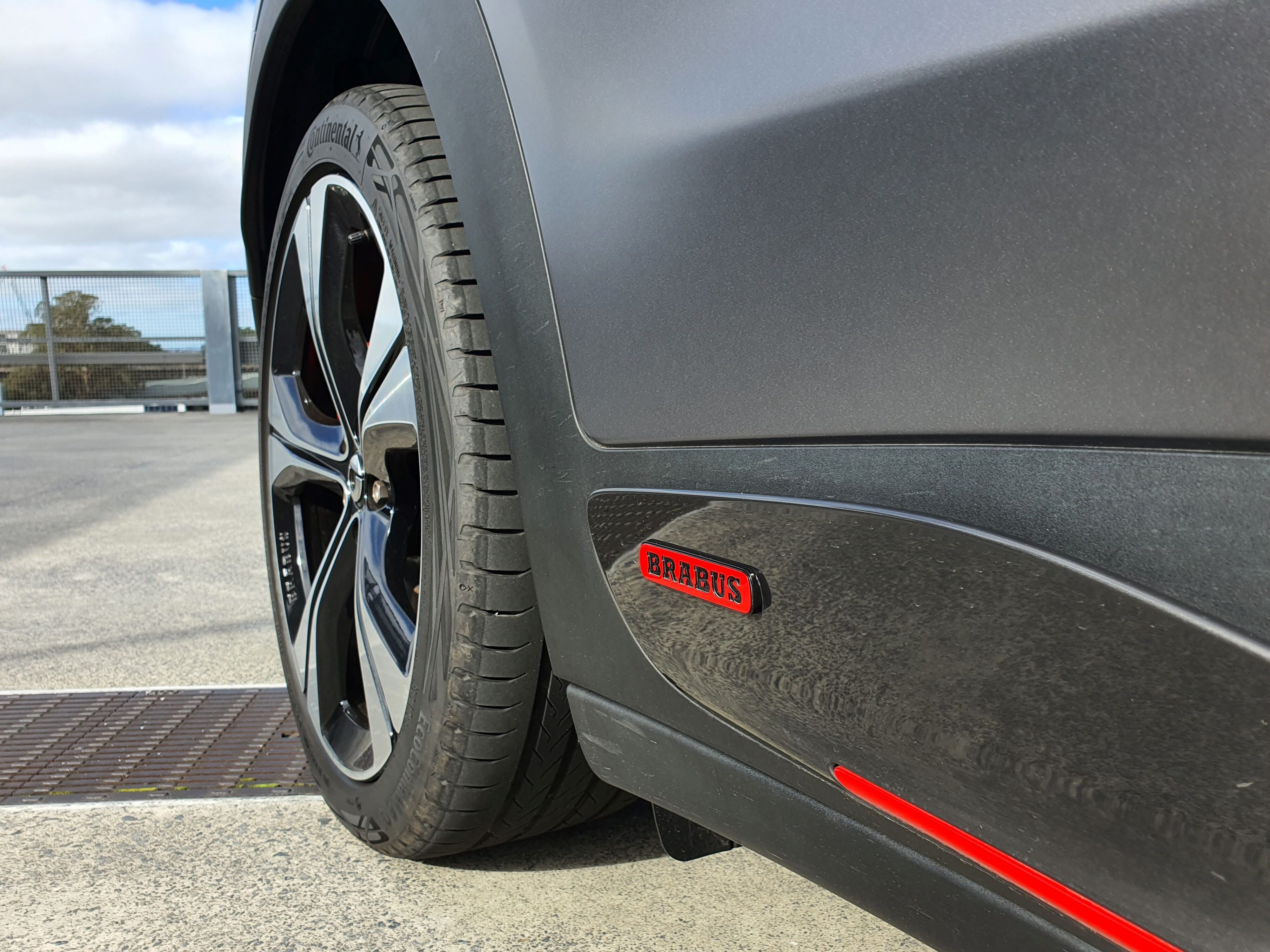 Brabus logo in red on the right rear door of a smart #3 Brabus.