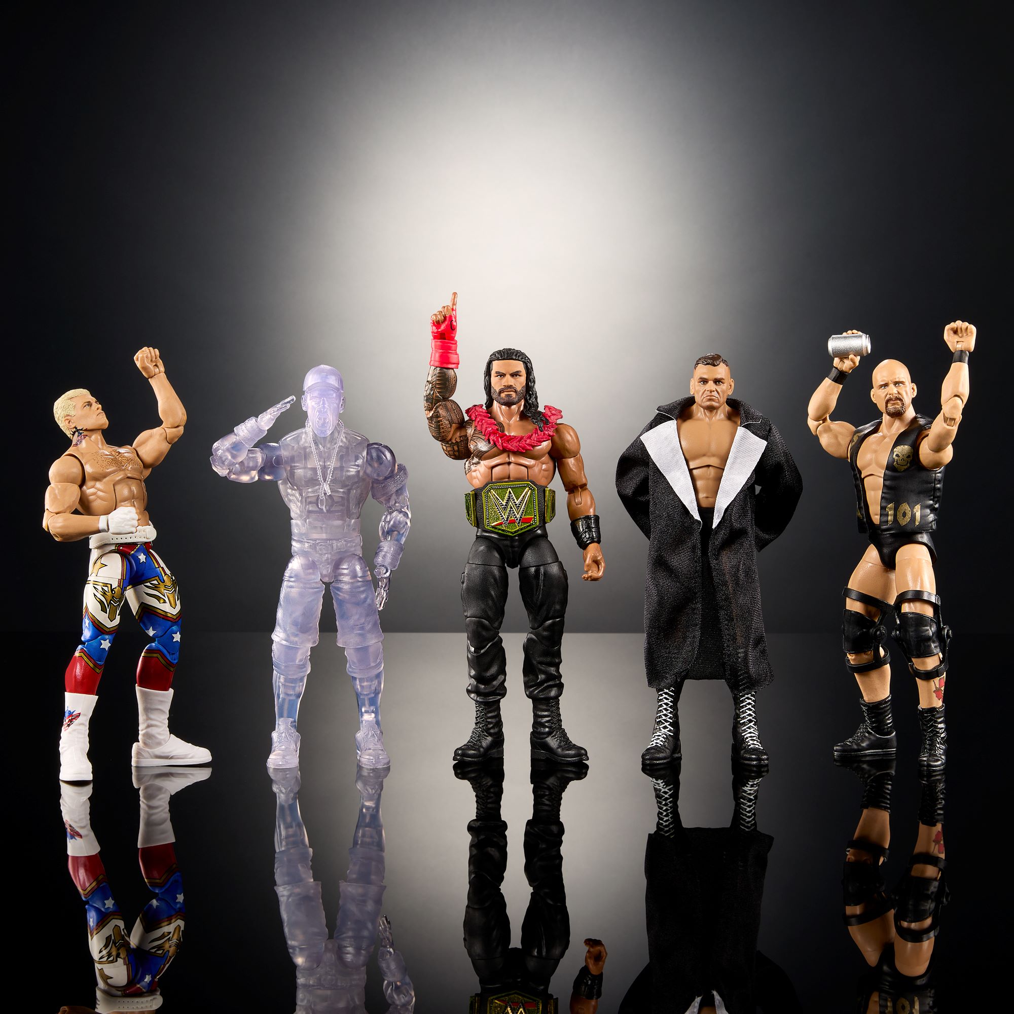 A photo of five Mattel WWE figurines in different poses.