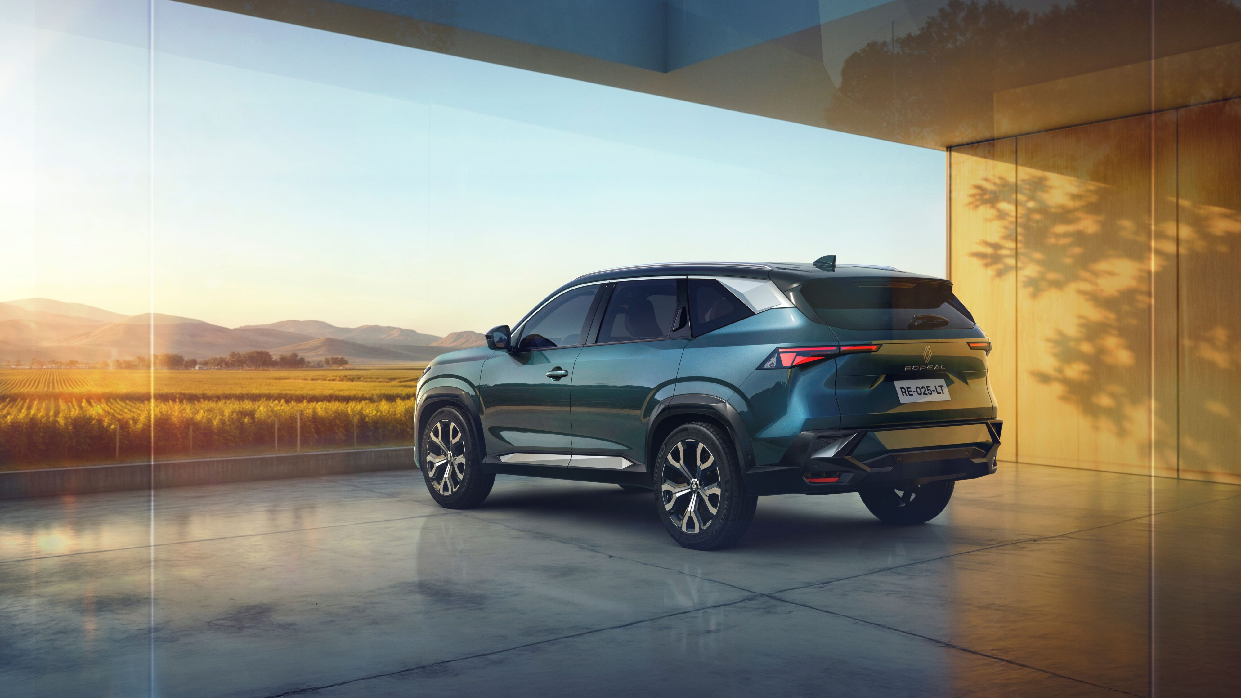 Rear three quarters view of a Renault Boreal SUV in a light green colour.