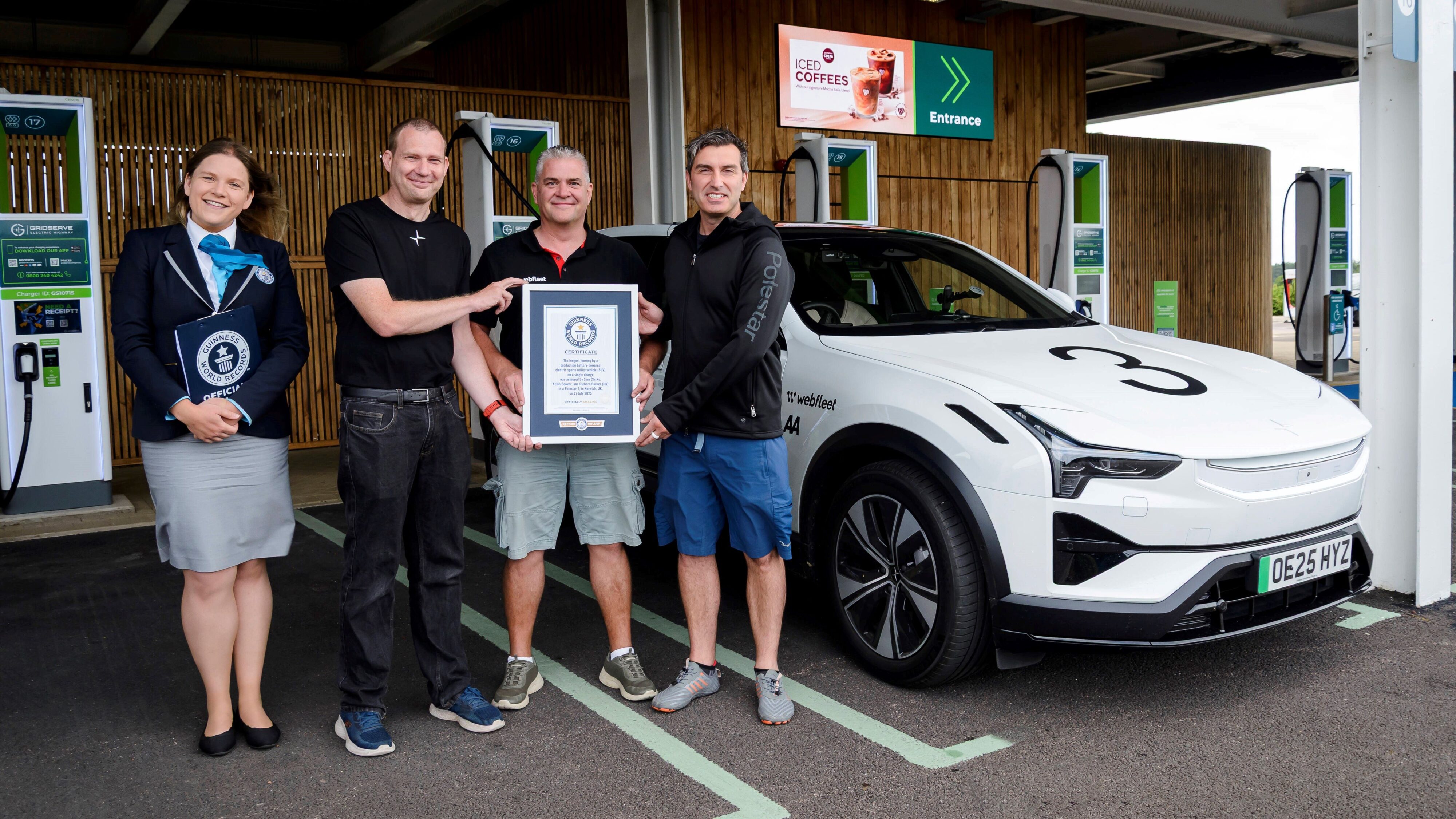 Polestar team and drivers pose with a judge from the Guinness Book of World Records after their achievement.