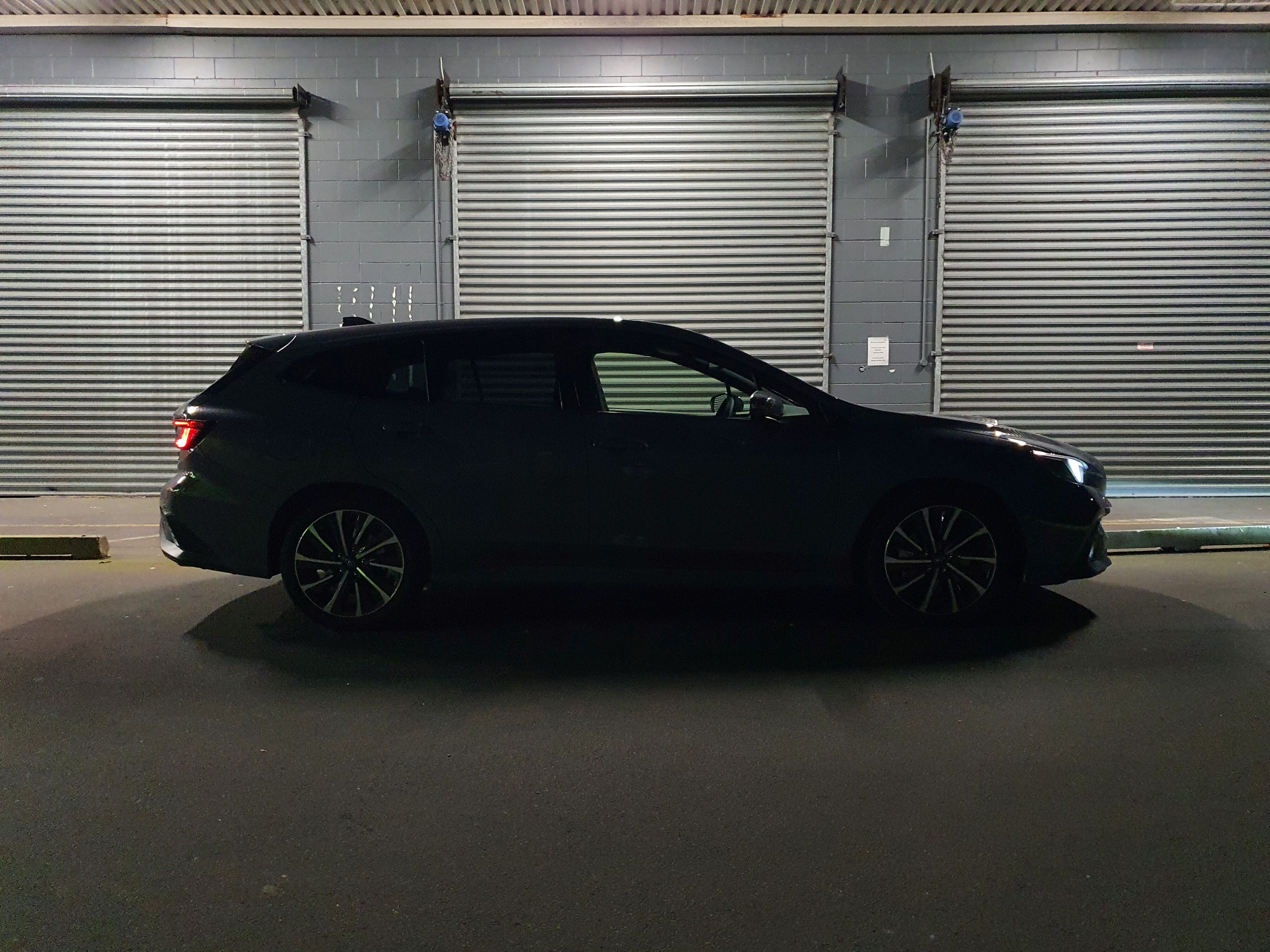 Side on view of a 2025 Subaru WRX GT tS Wagon in Asteroid Grey Pearl.