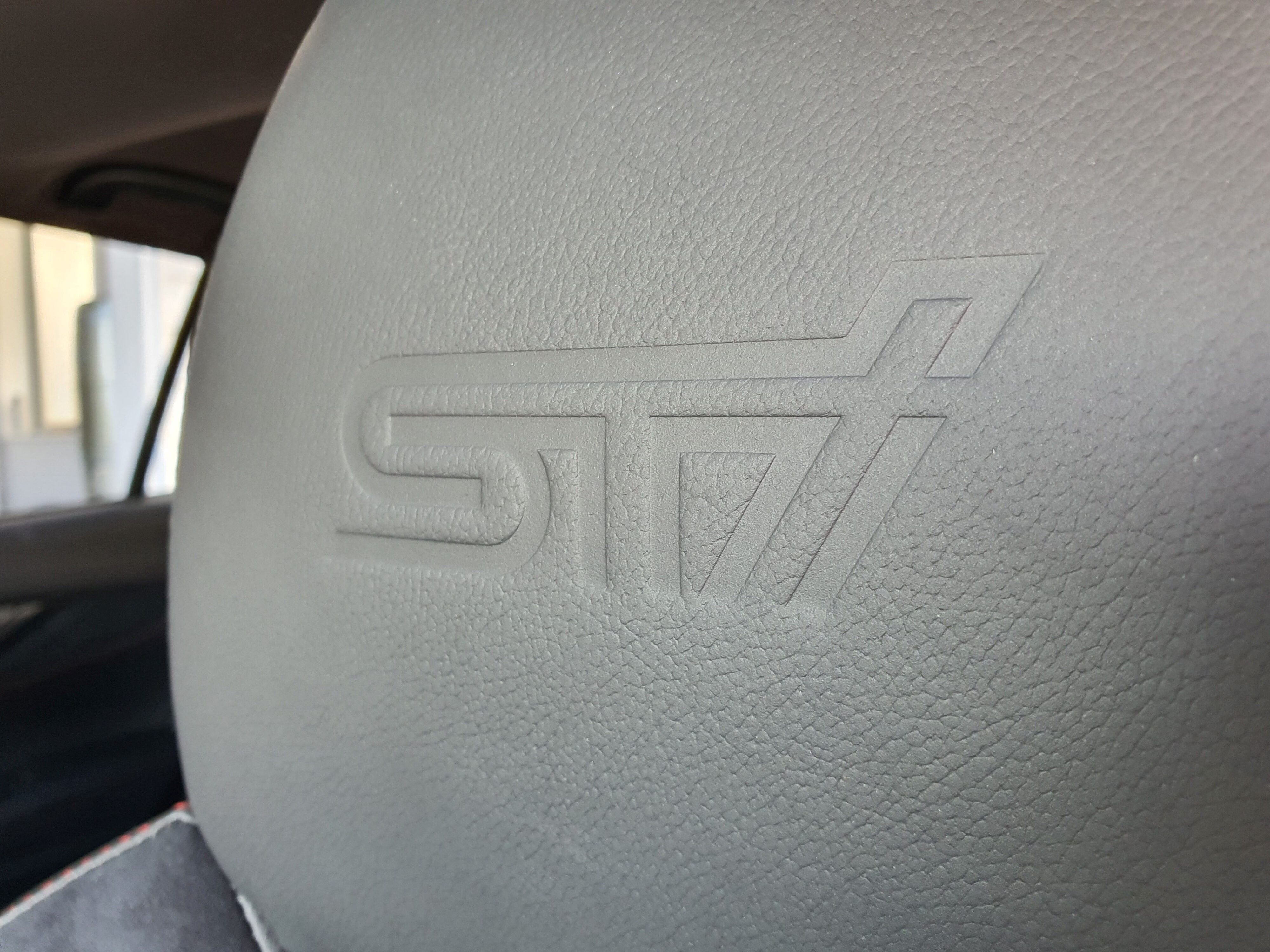 STi embossing on the seat headrests of a 2025 Subaru WRX GT tS Wagon.