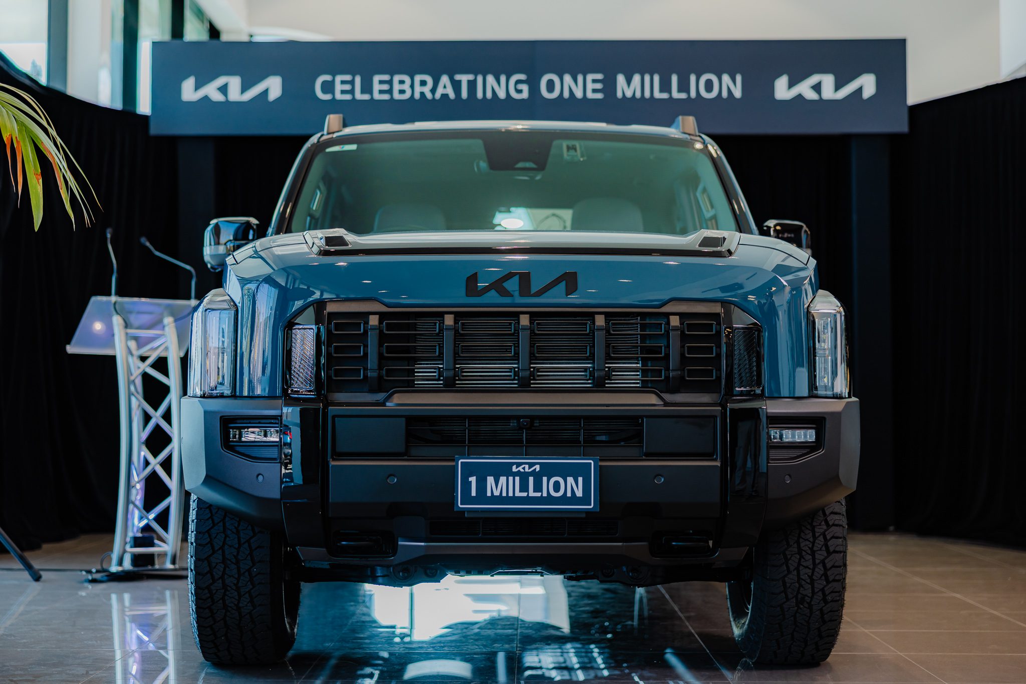 A photo of the one millionth Kia sold in Australia, a Tasman X-Pro Dual Cab.