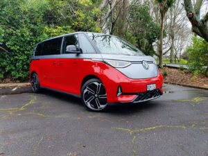 Front three quarters view of a 2025 Volkswagen ID.Buzz GTX in red and silver.