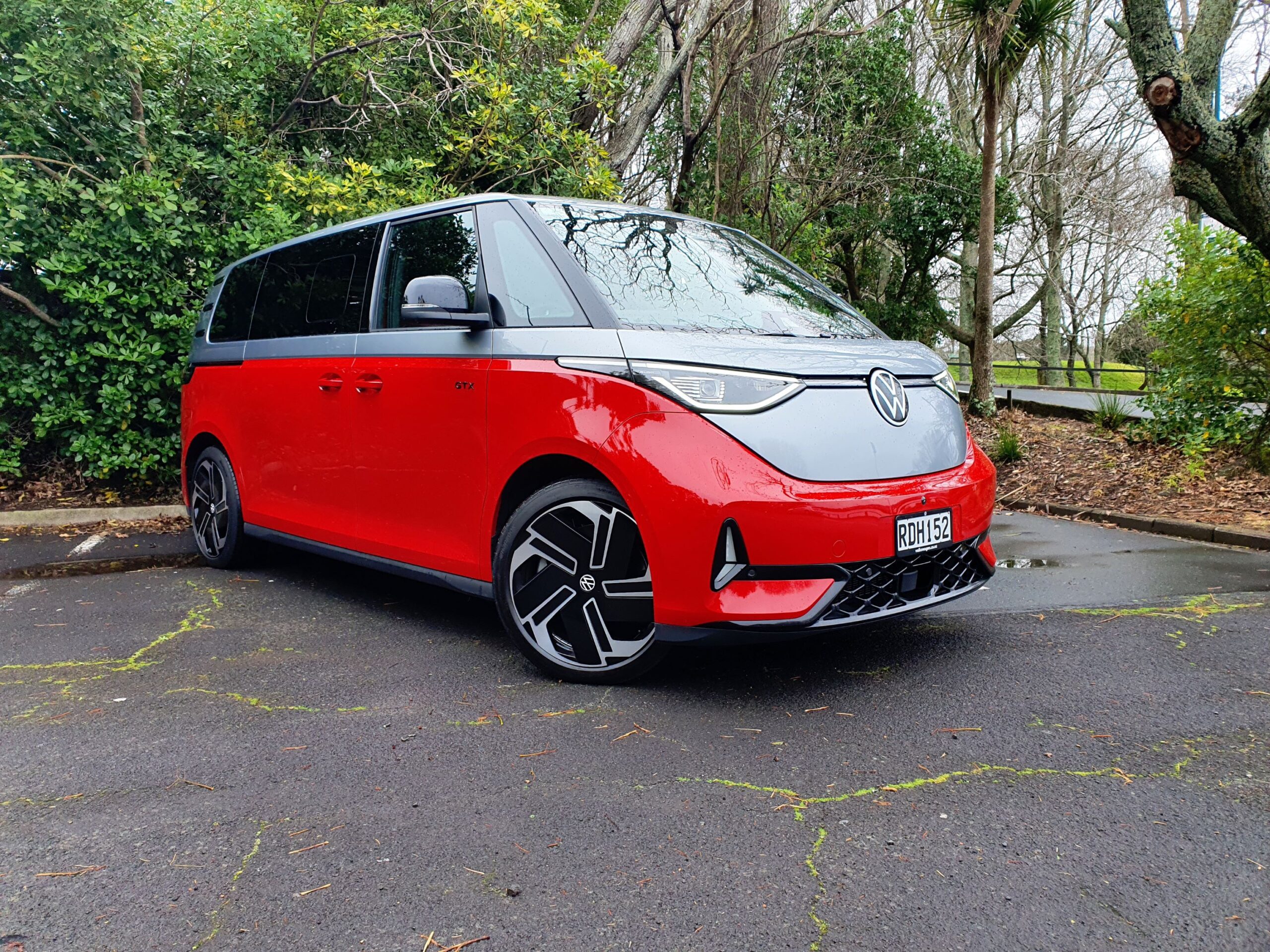 Front three quarters view of a 2025 Volkswagen ID.Buzz GTX in red and silver.