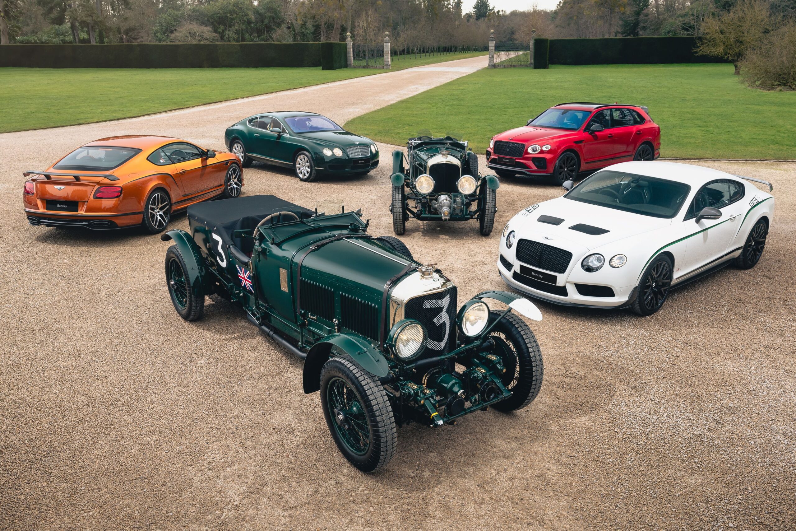 A photo of a collection of rare Bentleys with a green Blower front and centre.
