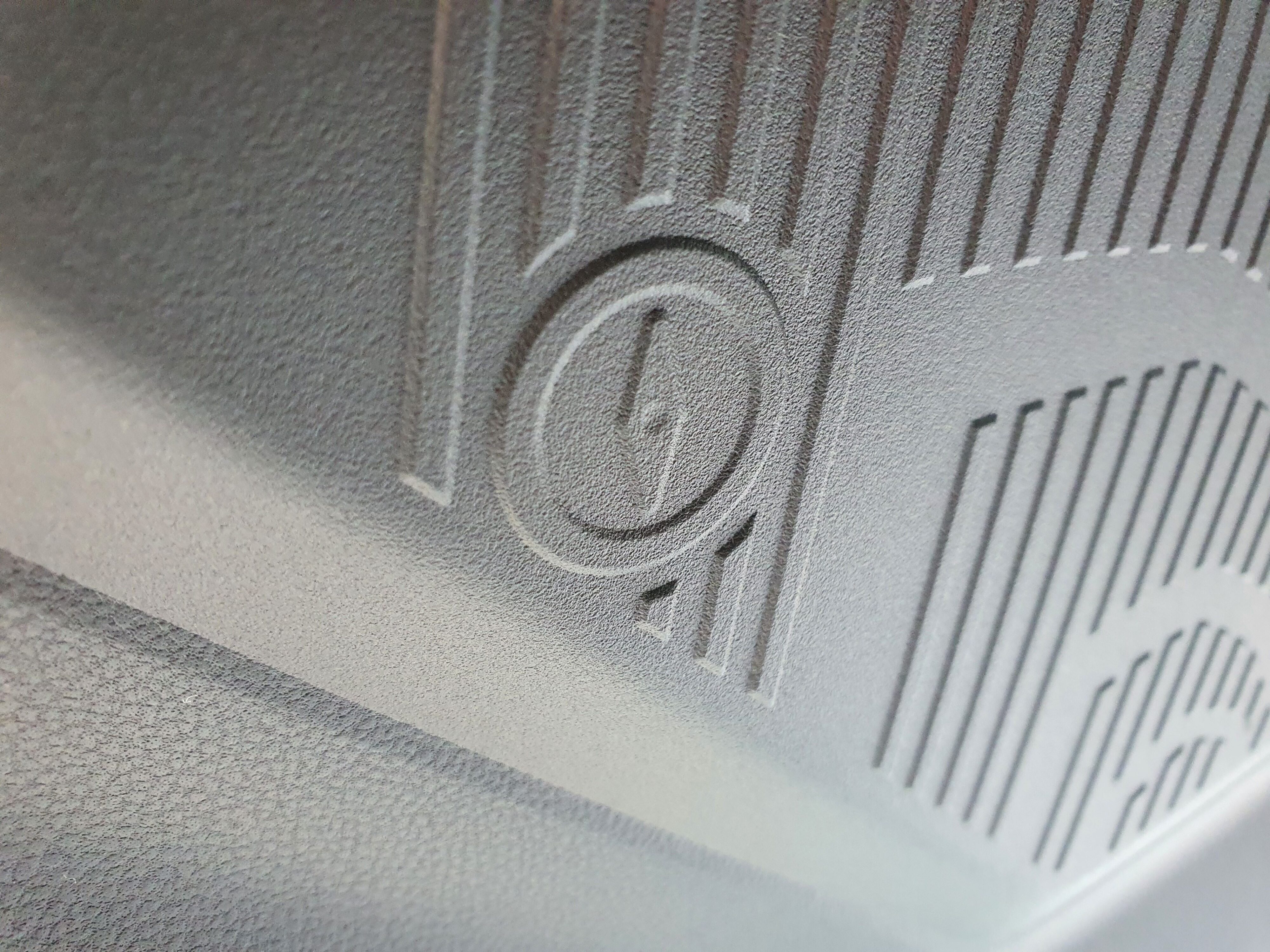 Motif of a compass on the interior of a 2025 Subaru Forester AWD Hybrid Touring.