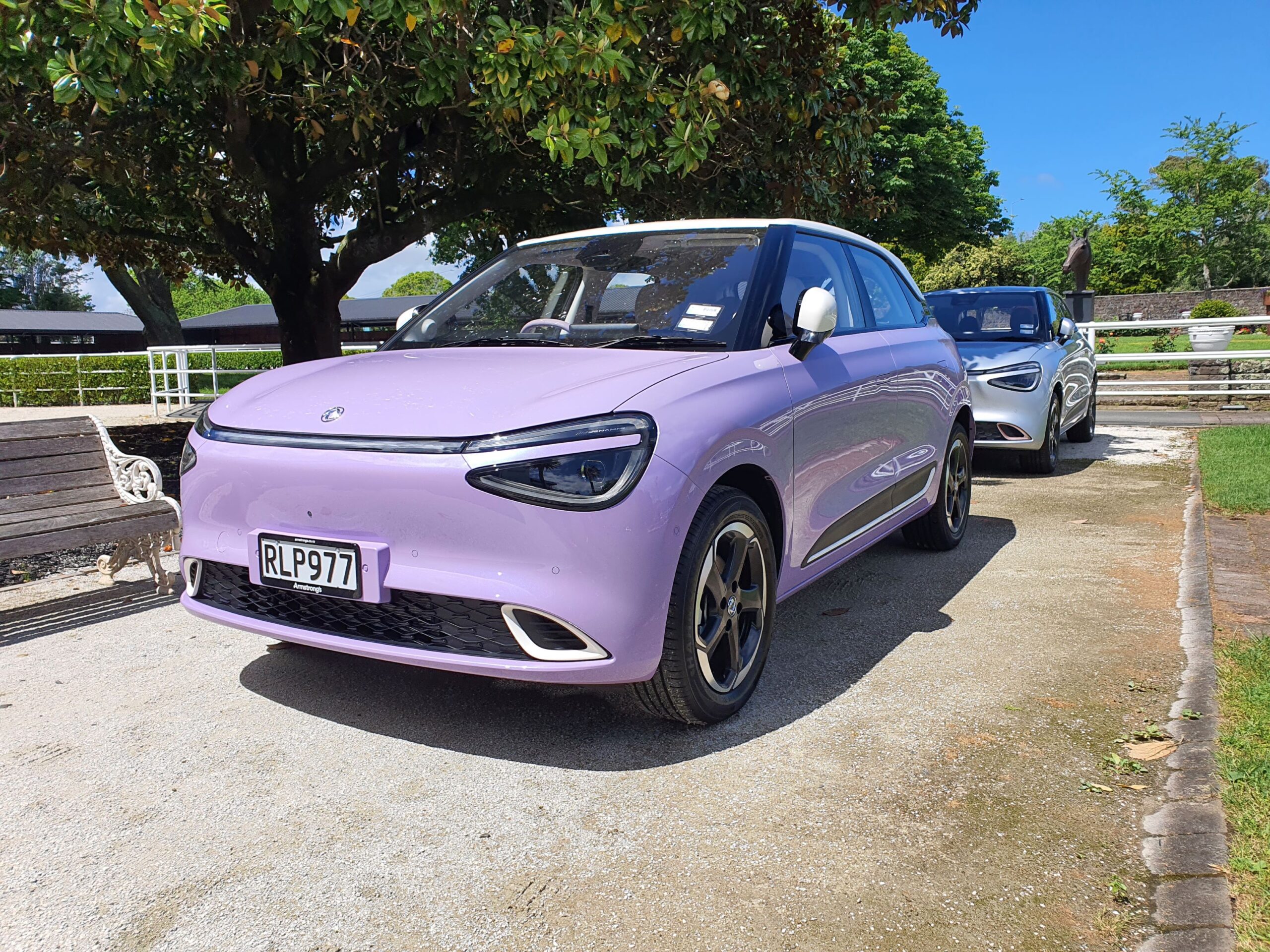 Front three quarters view of a 2025 Dongfeng Box in pink and white at the 2025 New Zealand launch of the Dongfeng Motors brand and Box EV.