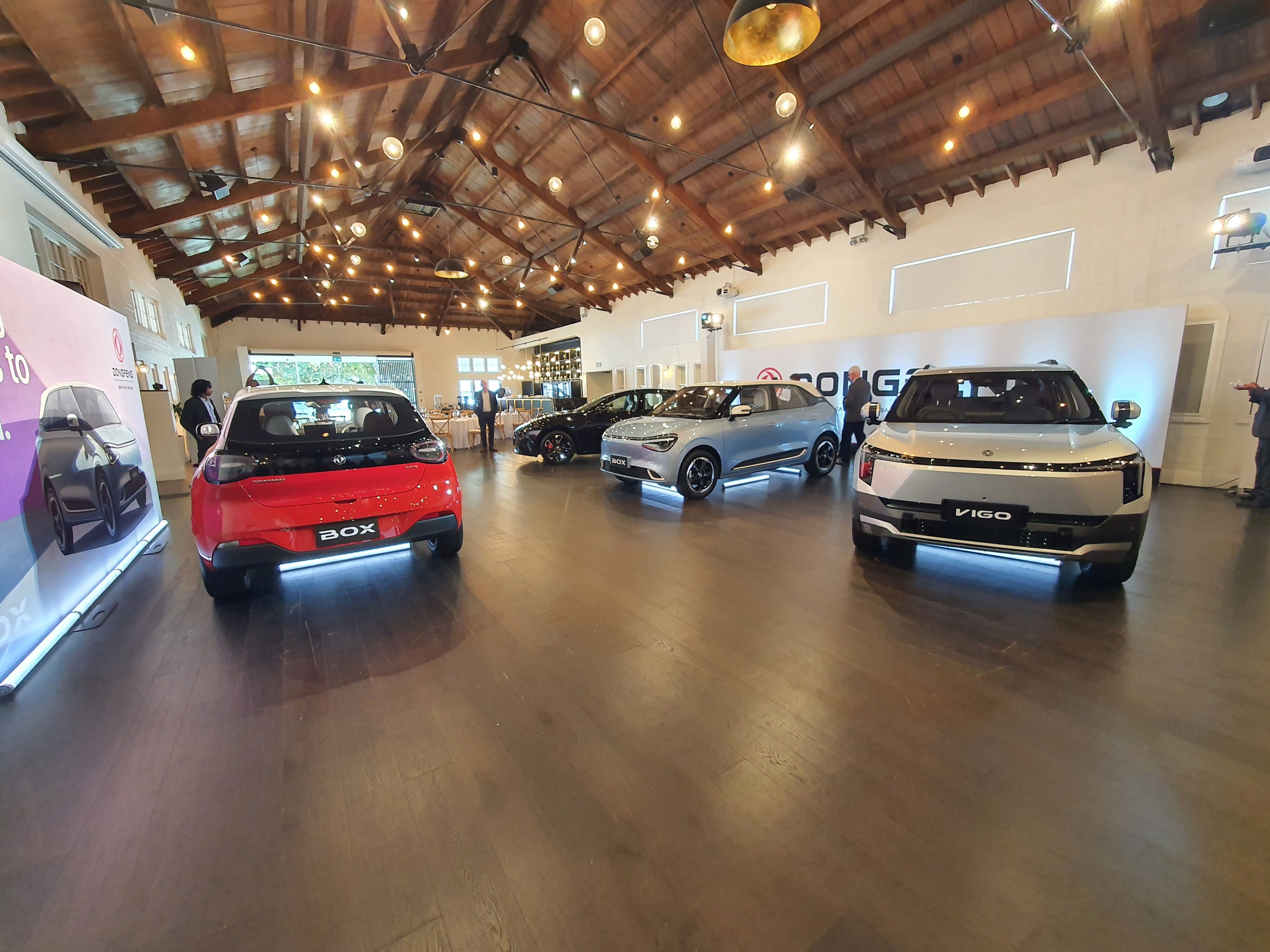 A photo of the full planned Dongfeng range for New Zealand including the Box, Vigo and 007 at the 2025 New Zealand launch of the Dongfeng Motors brand and Box EV.