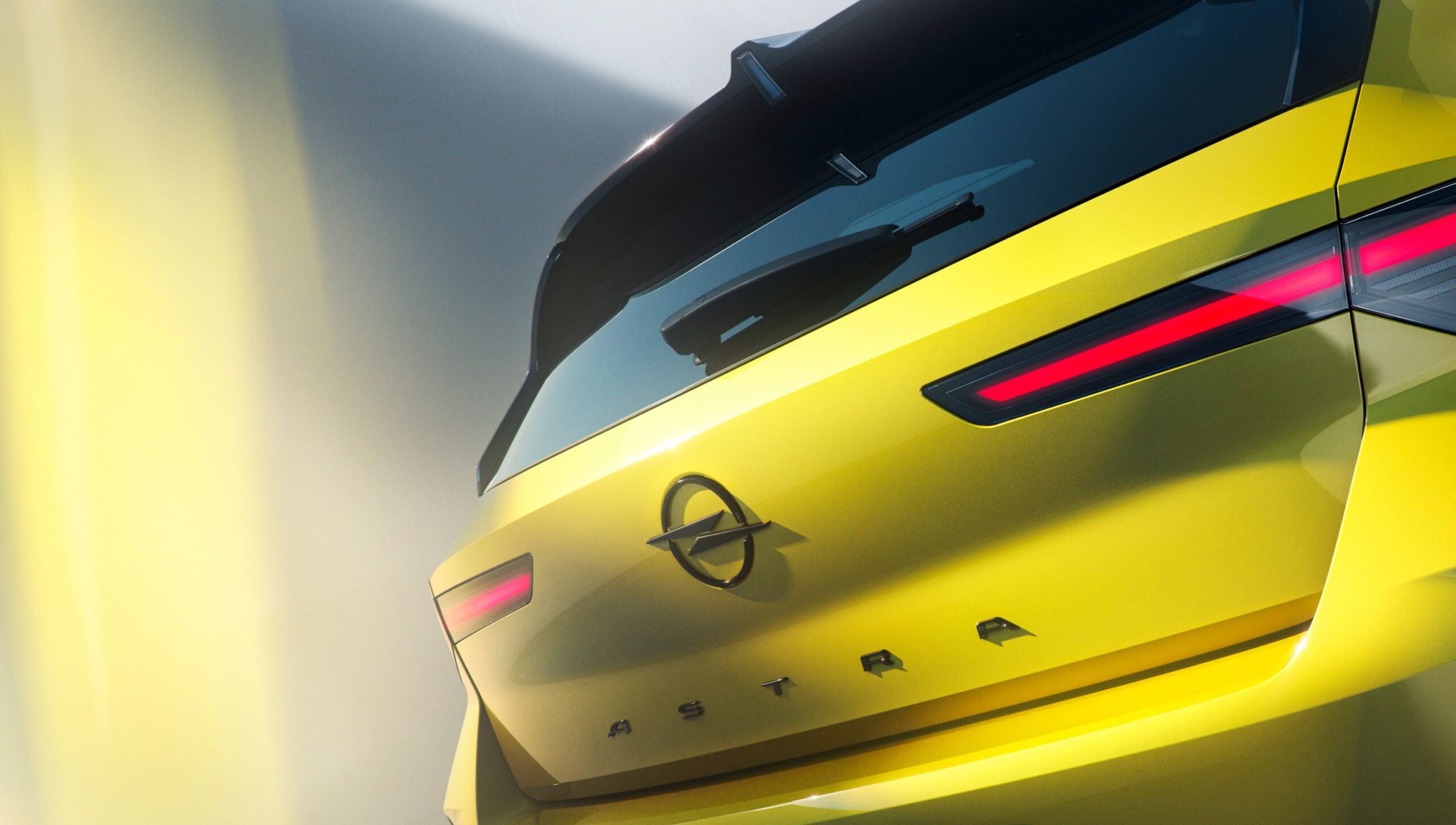A rear on teaser image of the upcoming Opel Astra.