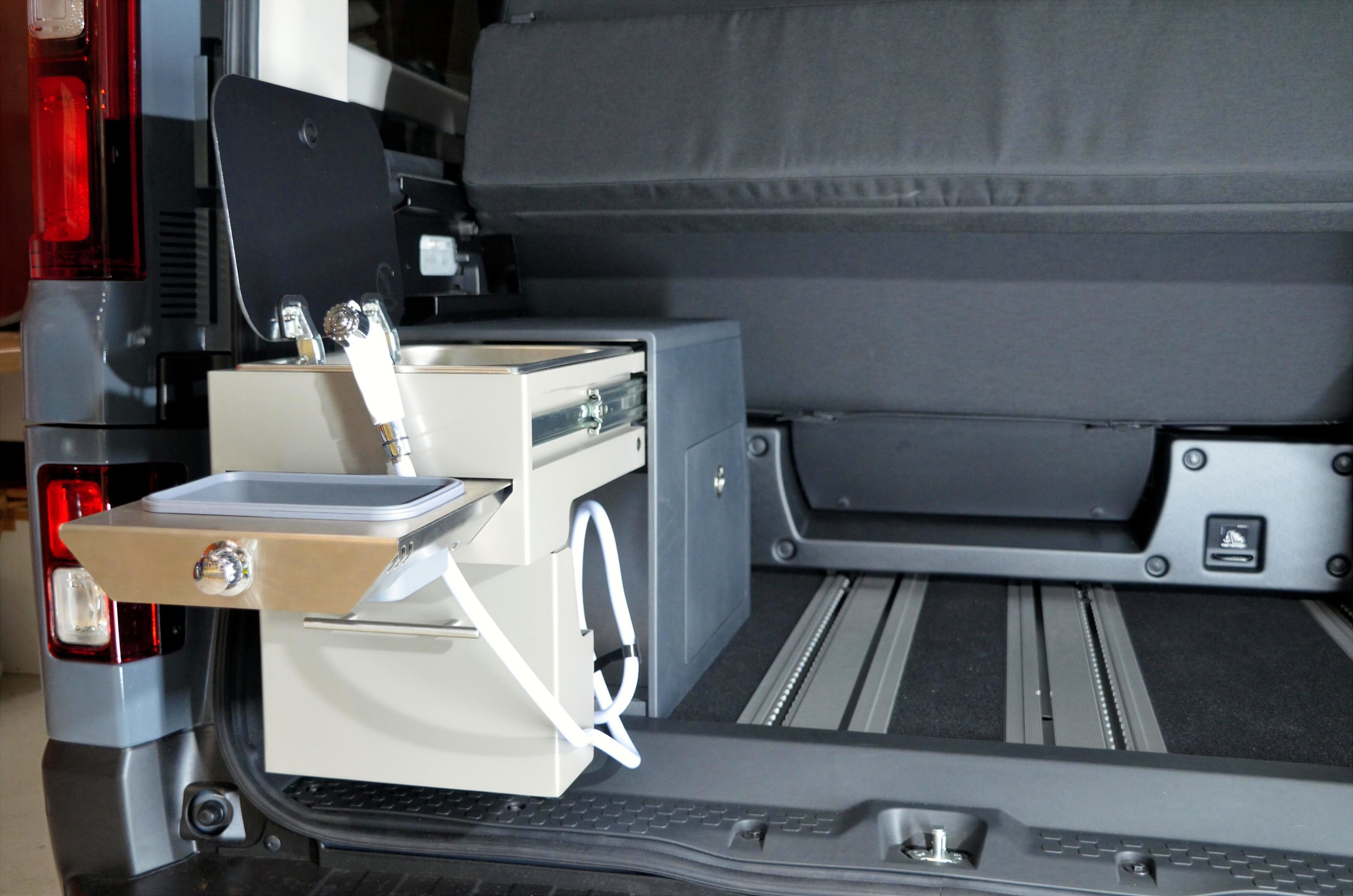 A photo of the camping kitchen in the boot of the new Renault Trafic Escapade.