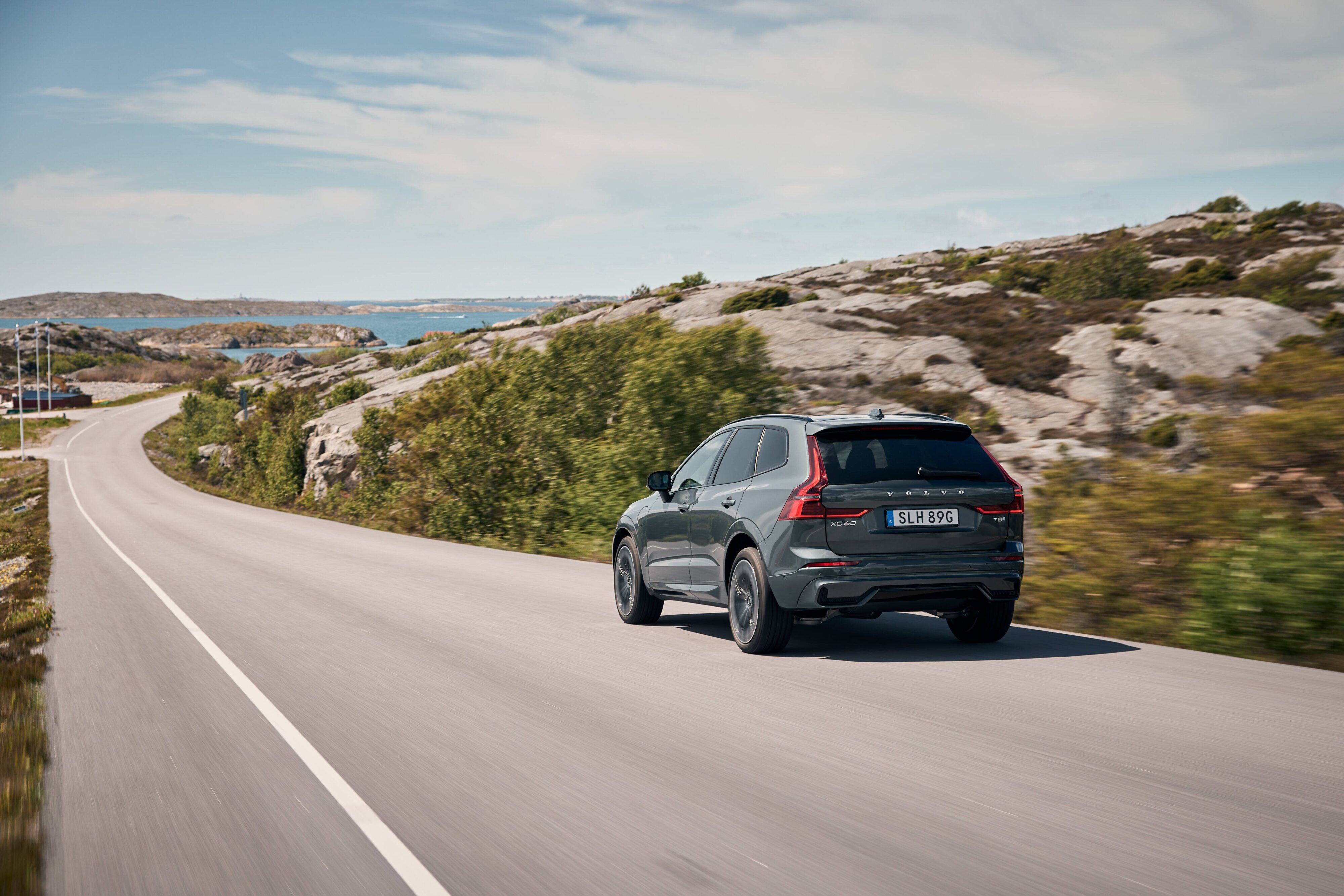 Rear three quarters view of a Volvo XC60 in motion.