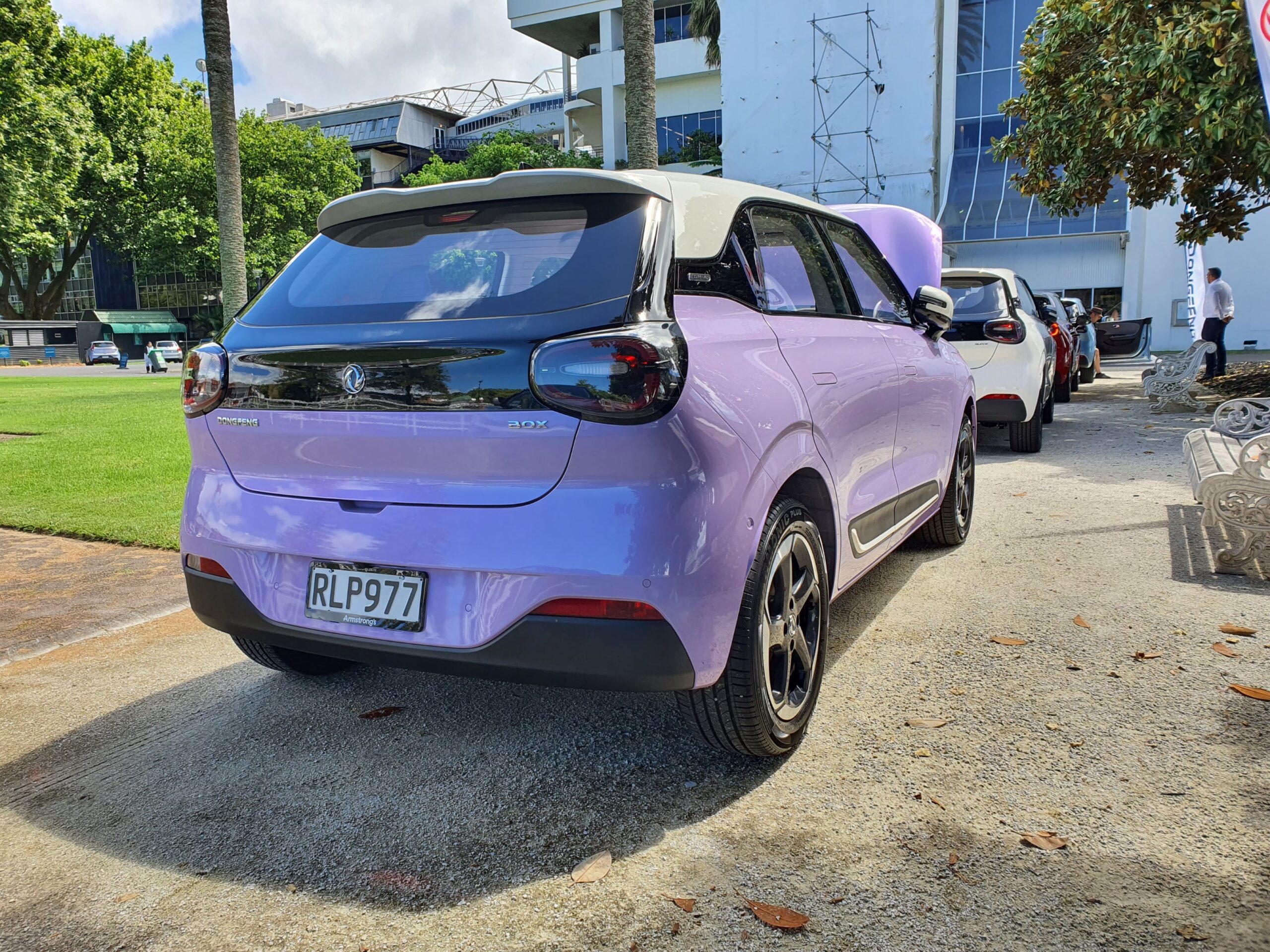 Rear three quarters view of a 2025 Dongfeng Box in pink and white at the 2025 New Zealand launch of the Dongfeng Motors brand and Box EV.