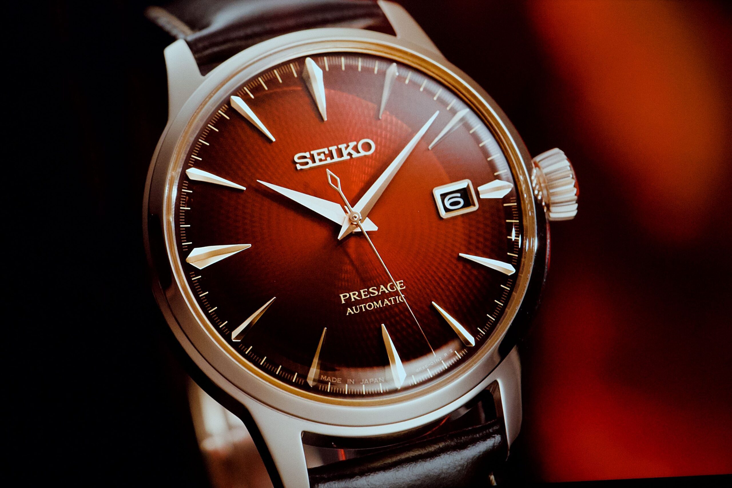 A photo of the dial on a Seiko Presage Cocktail Time 'Negroni' at the Zealand launch of the King Seiko Vanac at Otto Restaurant on K' Road.