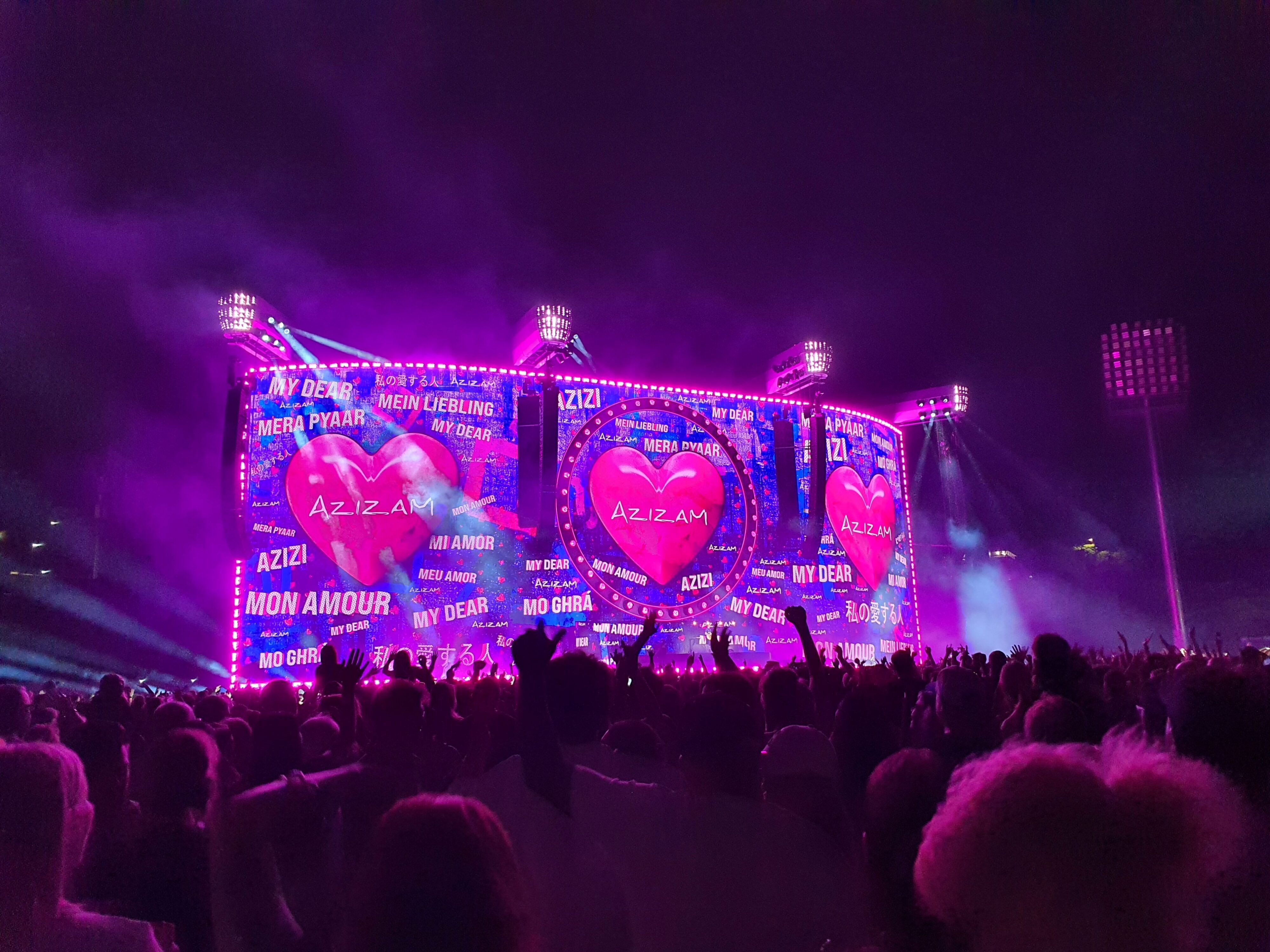 Photo of Ed Sheeran performing 'Azizam' on stage during the 2026 Loop Tour at Go Media Stadium in Auckland, New Zealand.