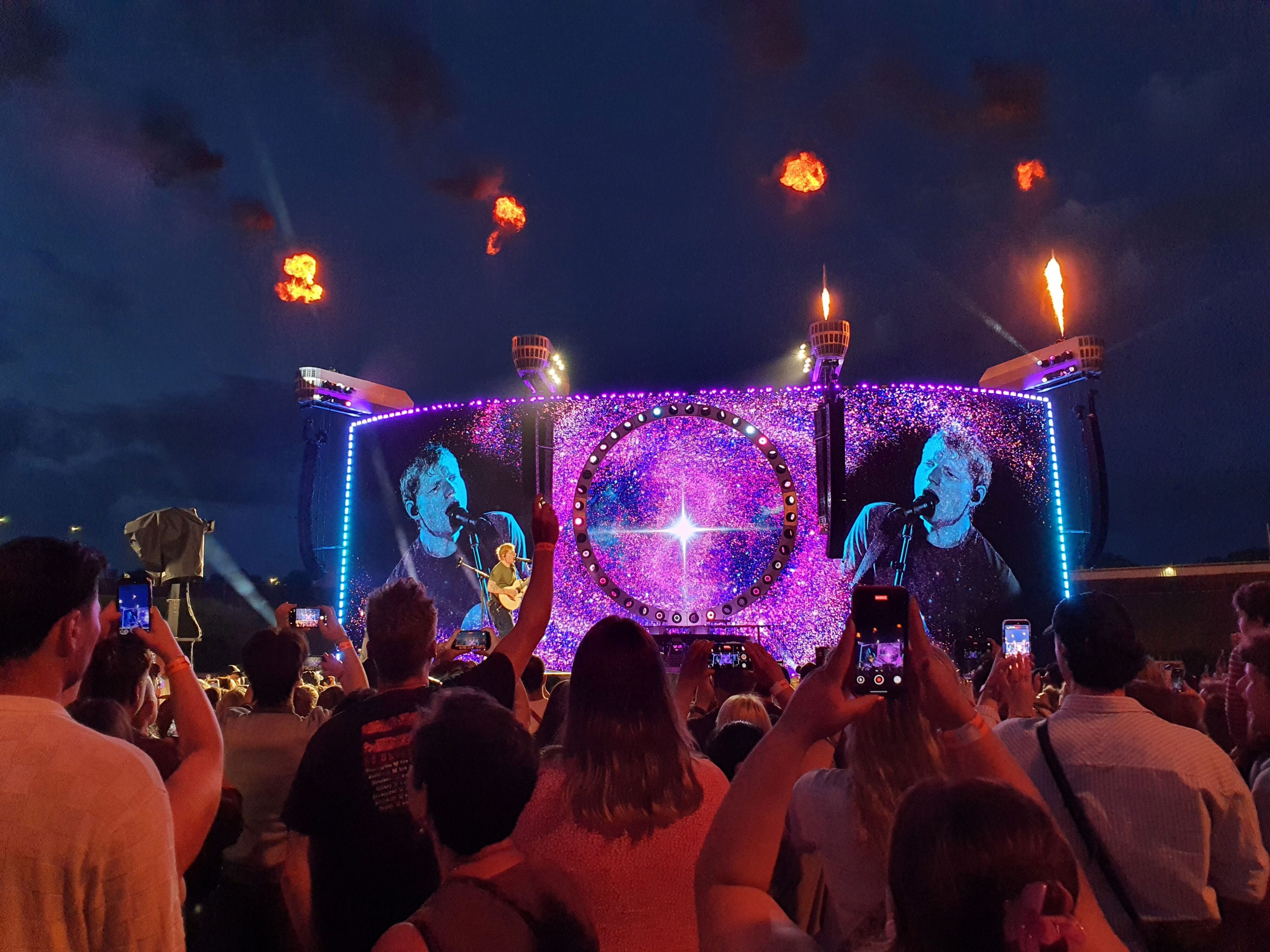 Photo of Ed Sheeran performing 'Celestial' on stage during the 2026 Loop Tour at Go Media Stadium in Auckland, New Zealand.