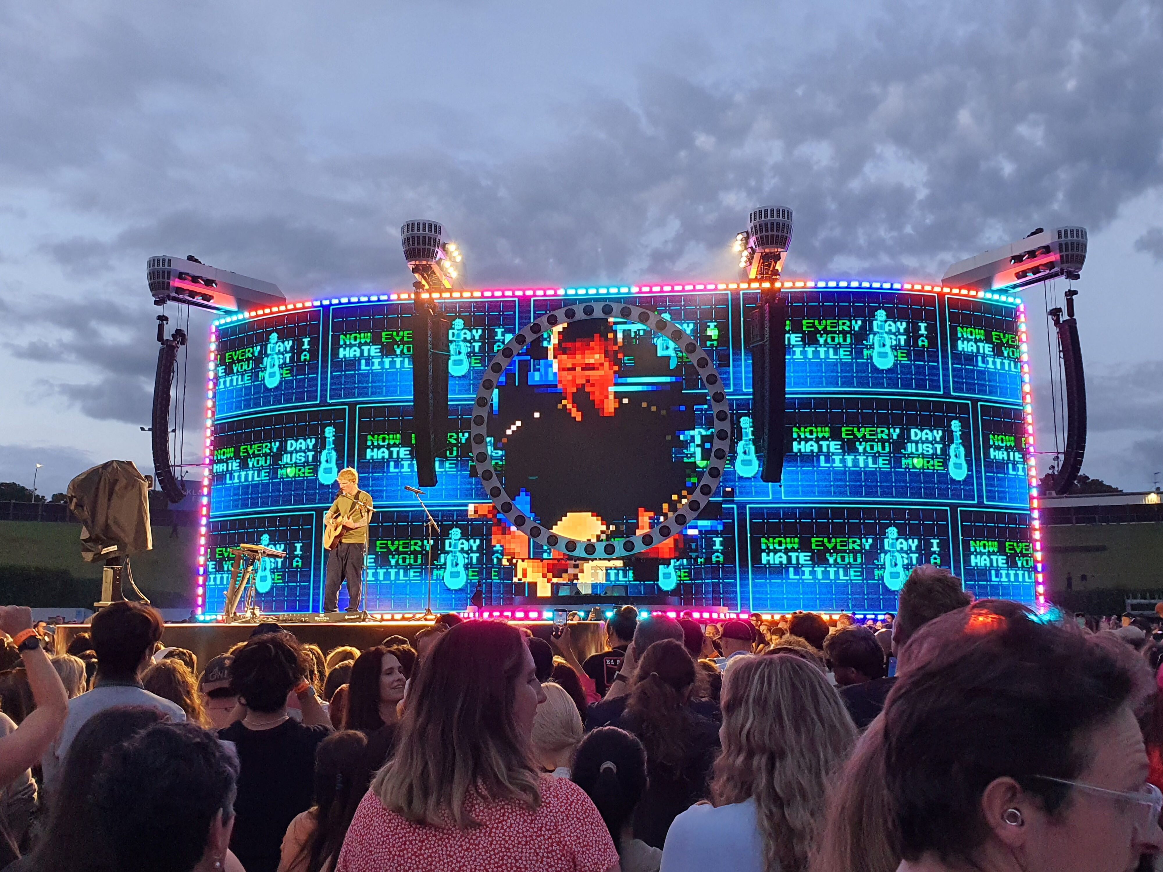 Photo of Ed Sheeran performing 'A Little More' on stage during the 2026 Loop Tour at Go Media Stadium in Auckland, New Zealand.