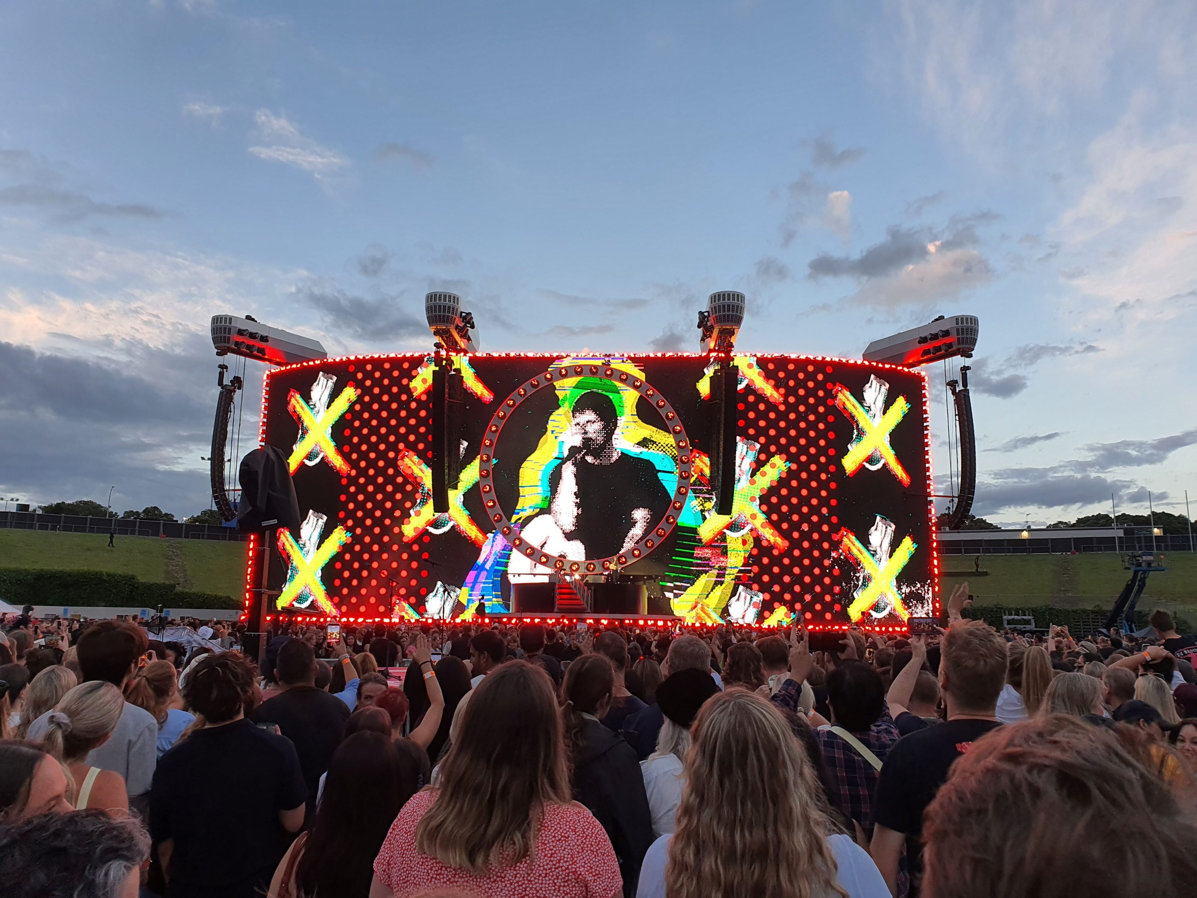 Photo of Ed Sheeran performing on stage during the 2026 Loop Tour at Go Media Stadium in Auckland, New Zealand.