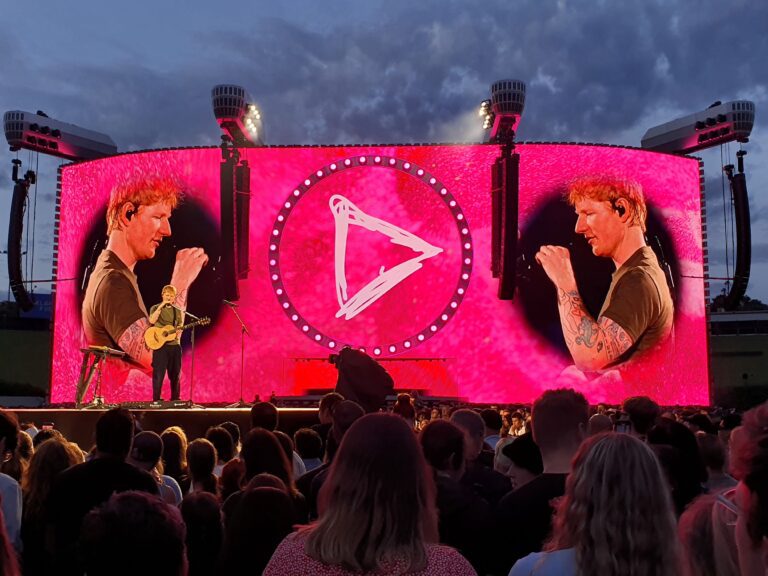 Photo of Ed Sheeran performing on stage during the Loop Tour 2026 at Go Media Stadium in Auckland, New Zealand.
