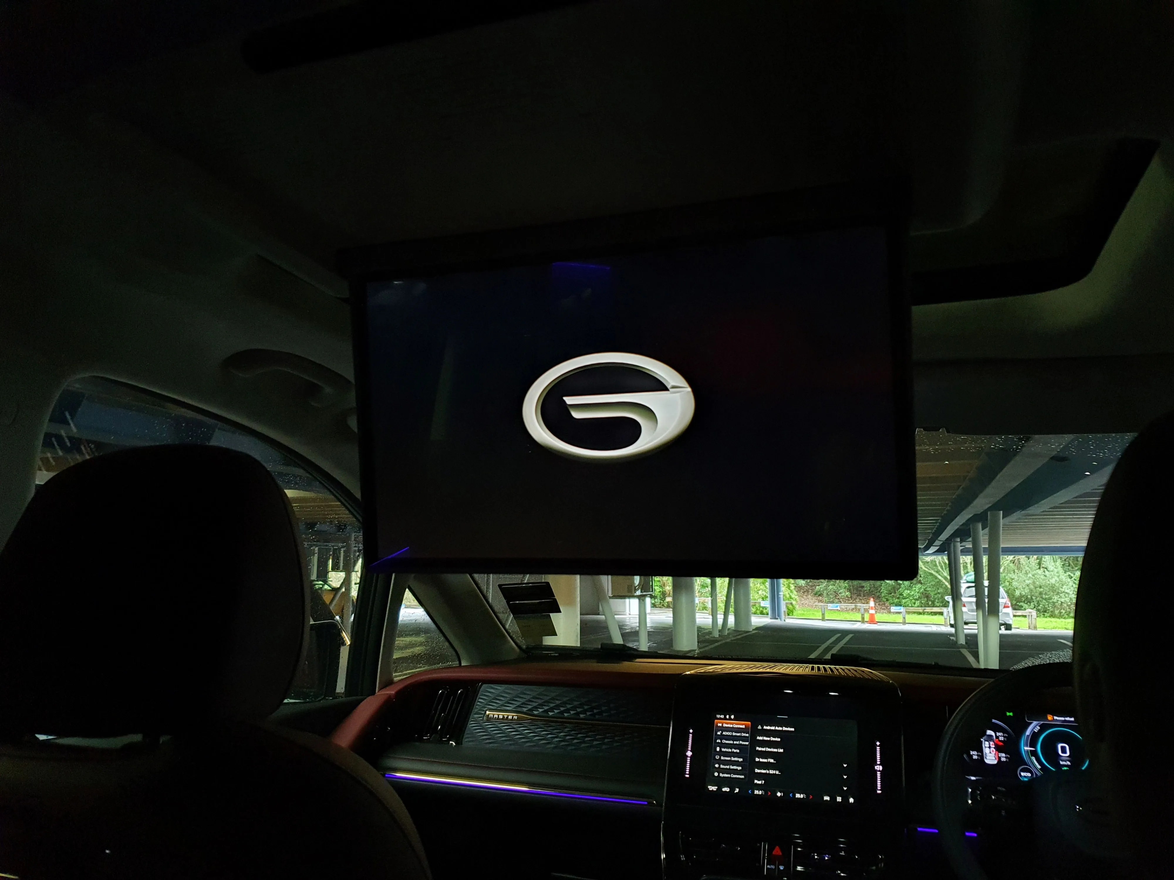 View of the drop down TV screen as seen from the middle row in a 2026 GAC M8 Master.