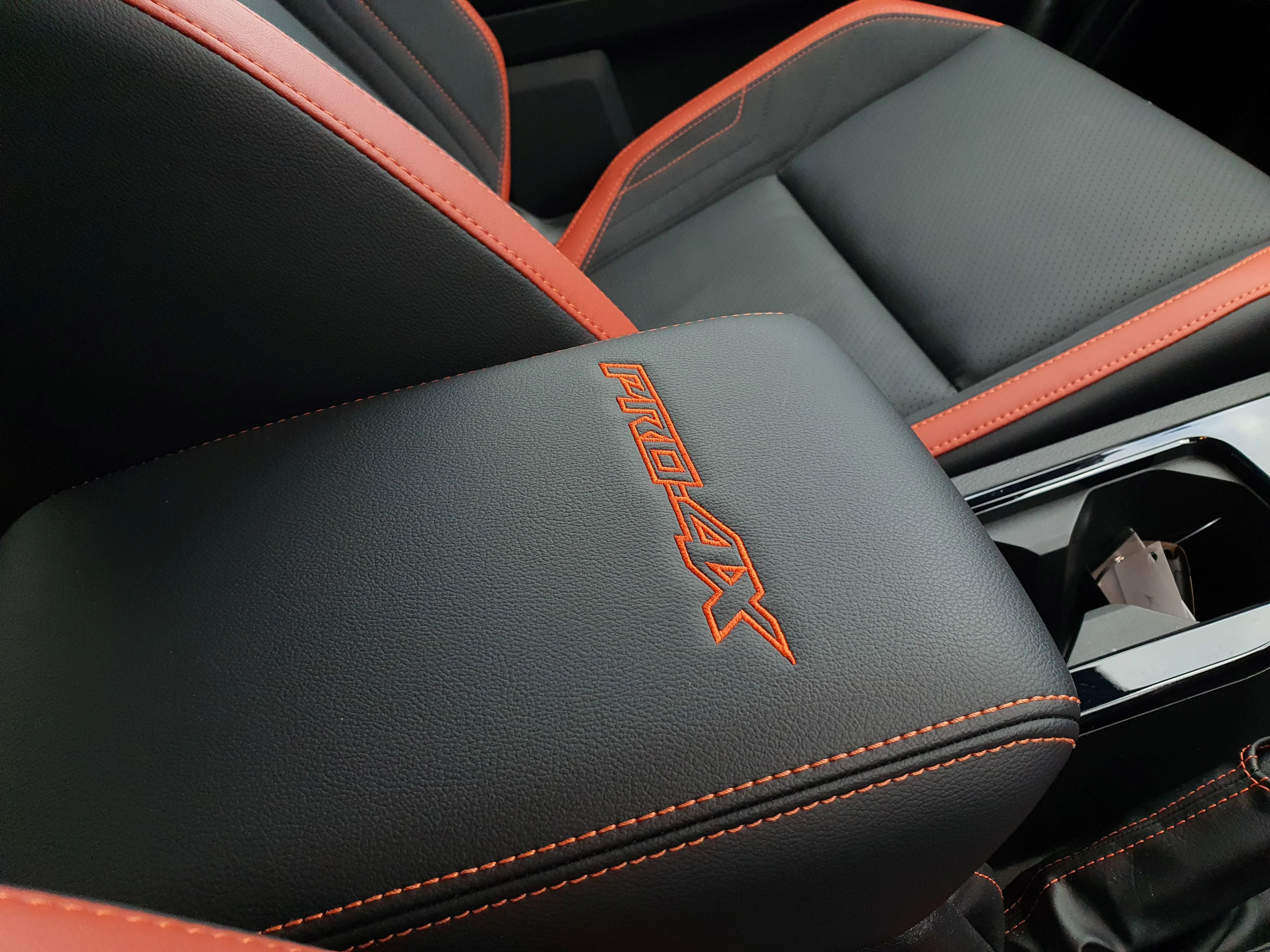 Pro-4X embossing on the central armrest of a 2026 Nissan Navara Pro-4X.