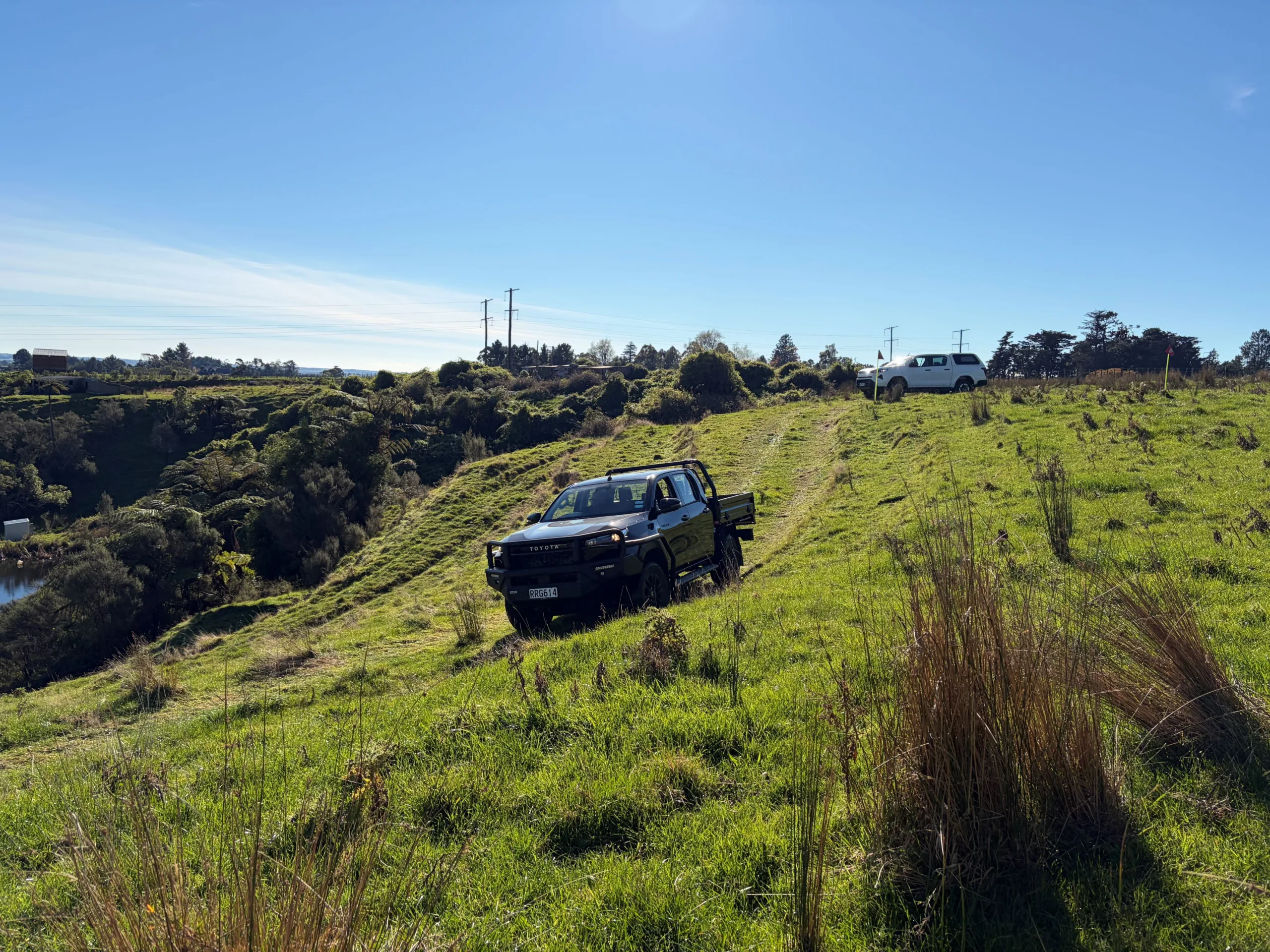 A black 2026 Toyota Hilux SR goes off-road on the New Zealand launch of ninth-generation Toyota Hilux, taken at Heights Experience in Manawatu, New Zealand.