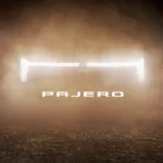 Teaser image of the new Mitsubishi Pajero showing an illuminated front grille.