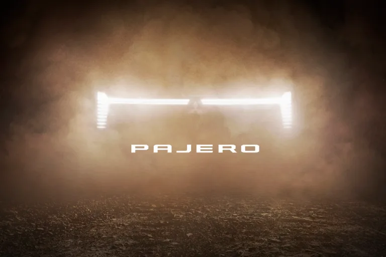 Teaser image of the new Mitsubishi Pajero showing an illuminated front grille.